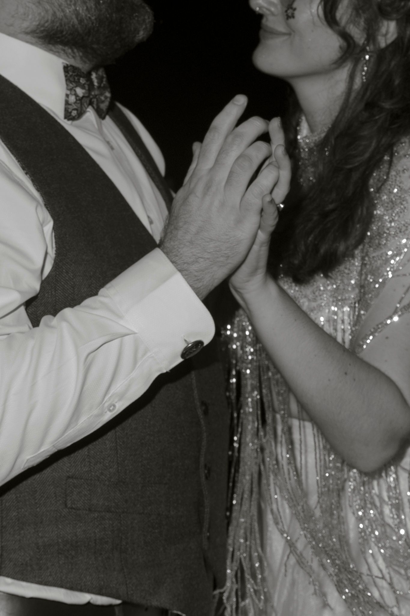 Black and white photo sequence shows people dancing and embracing at what appears to be a party or celebration.