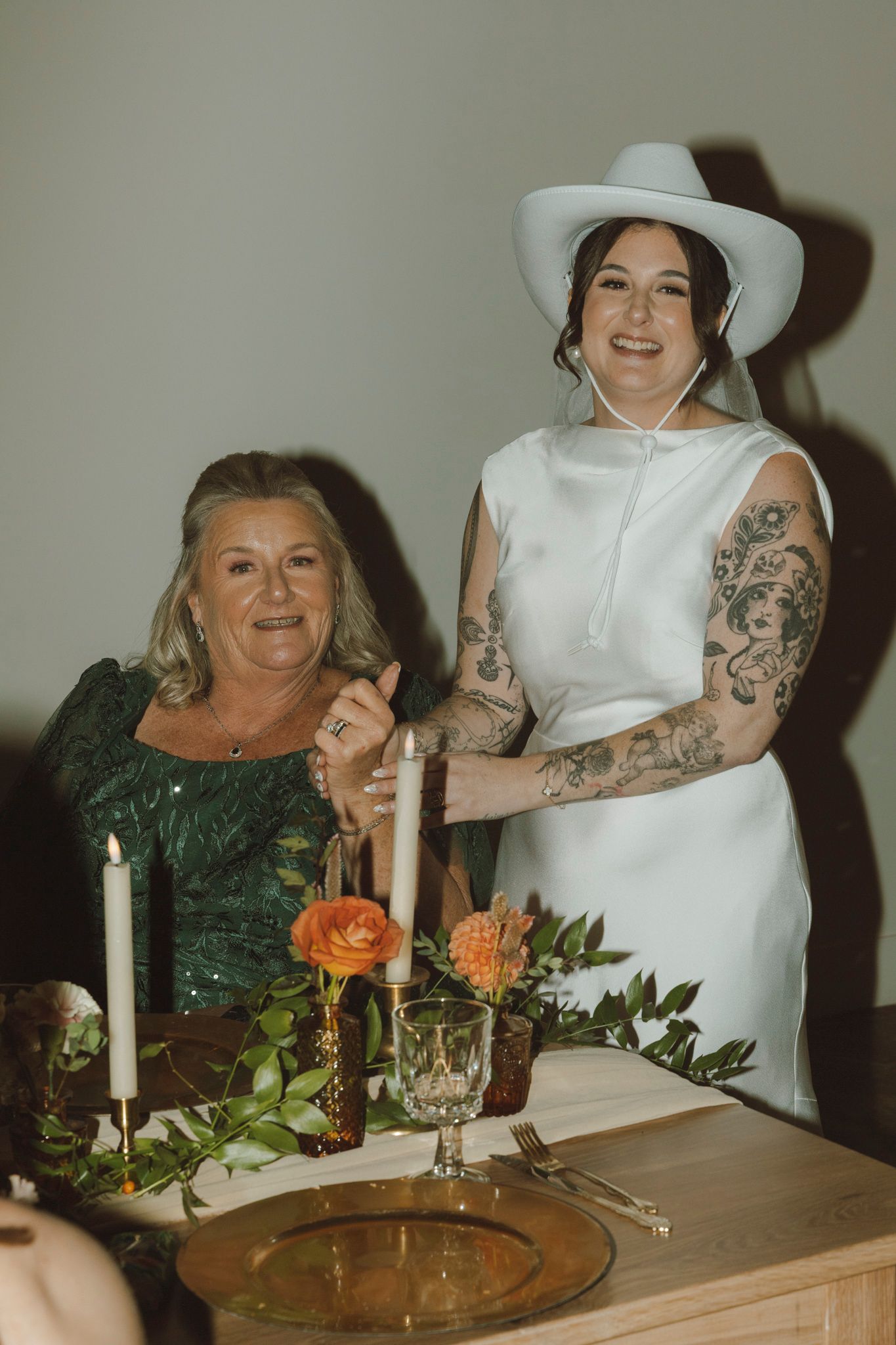 A sequence of candid wedding reception moments showing guests seated at a decorated table with candles and floral arrangements.