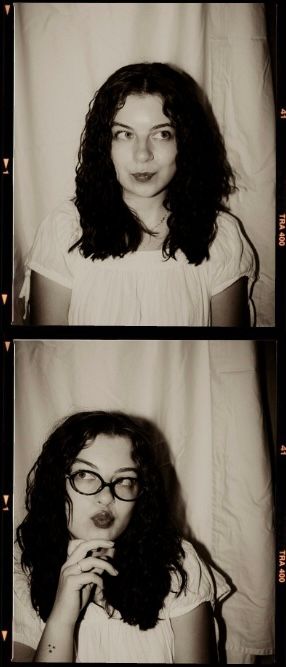 Vintage film strip photo booth portraits of a young woman with dark curly hair, shown natural then wearing glasses.