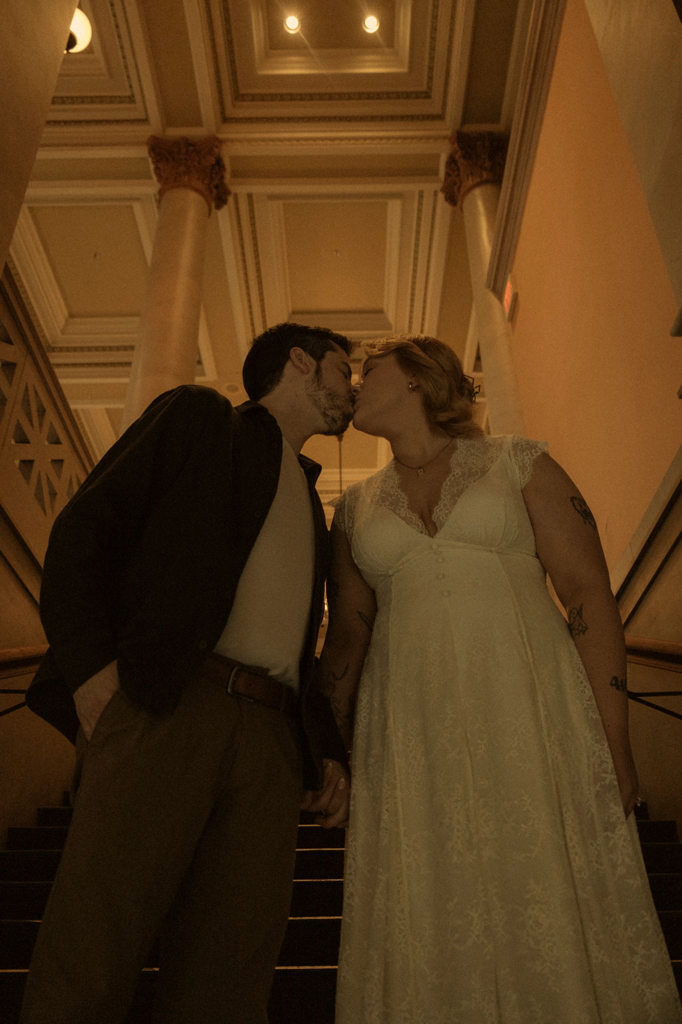 A romantic sequence of wedding photos showing a couple sharing their first dance in an elegant ballroom setting.