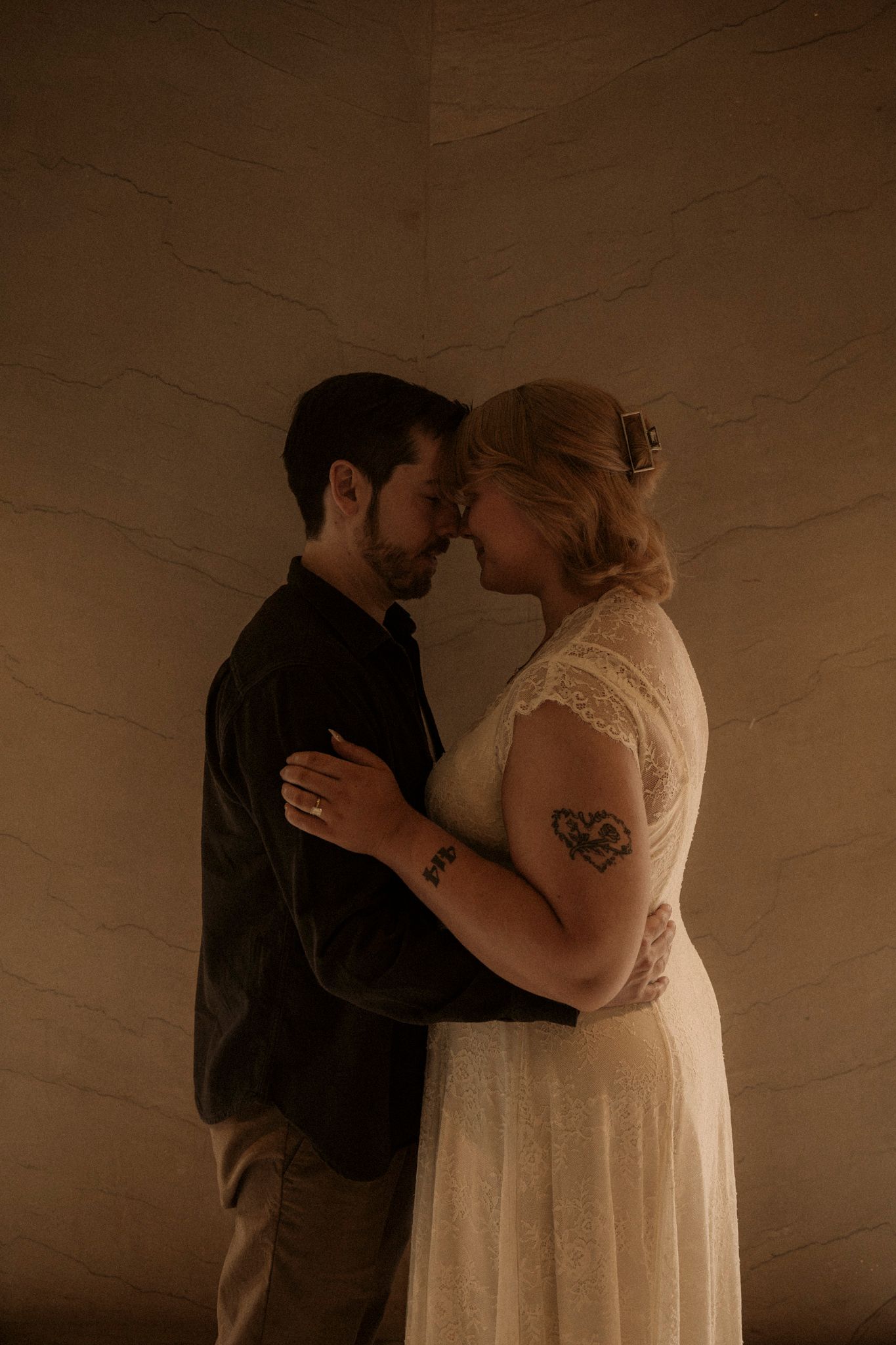 A romantic sepia-toned sequence shows a couple in wedding attire sharing an intimate kiss.