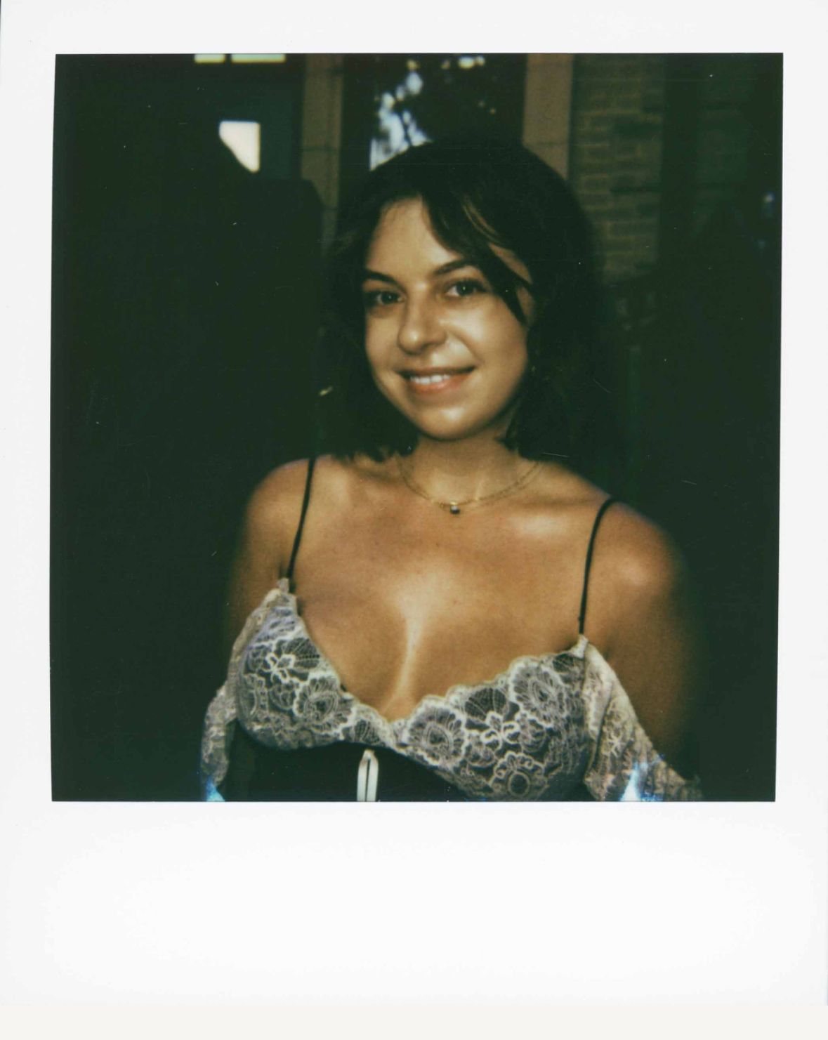 A series of vintage-style polaroid photos showing someone in a black dress and necklace against dark backgrounds.