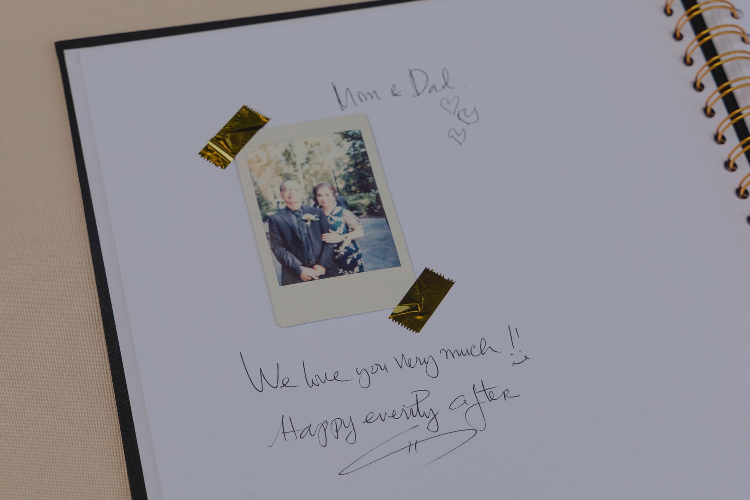 A series of polaroid photos and handwritten notes arranged in a row on a light colored surface.