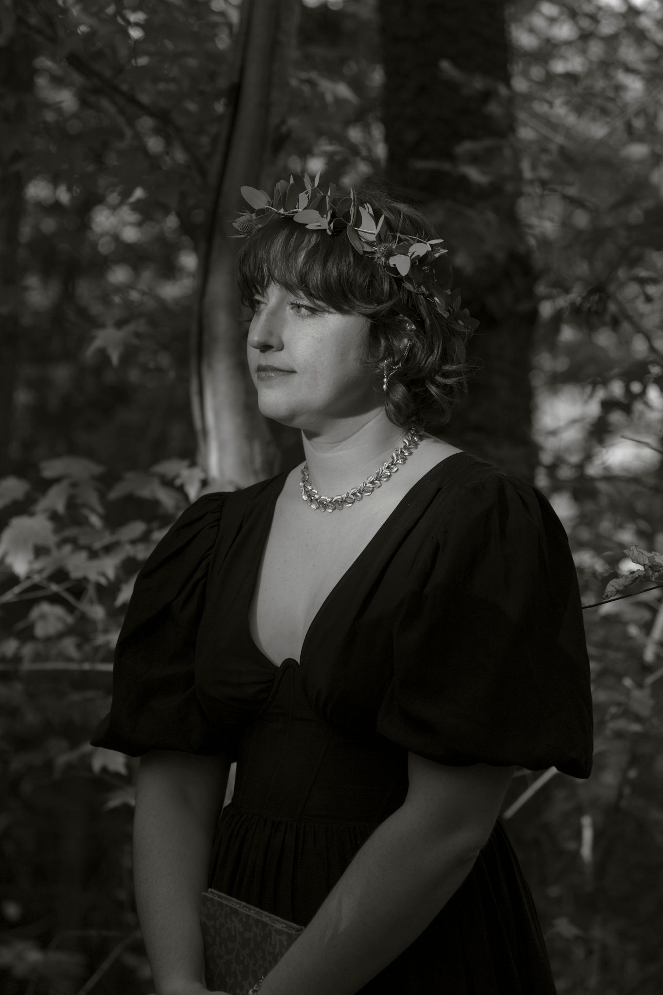 Black and white portrait series showing dramatic lighting and vintage-inspired styling with dark clothing.