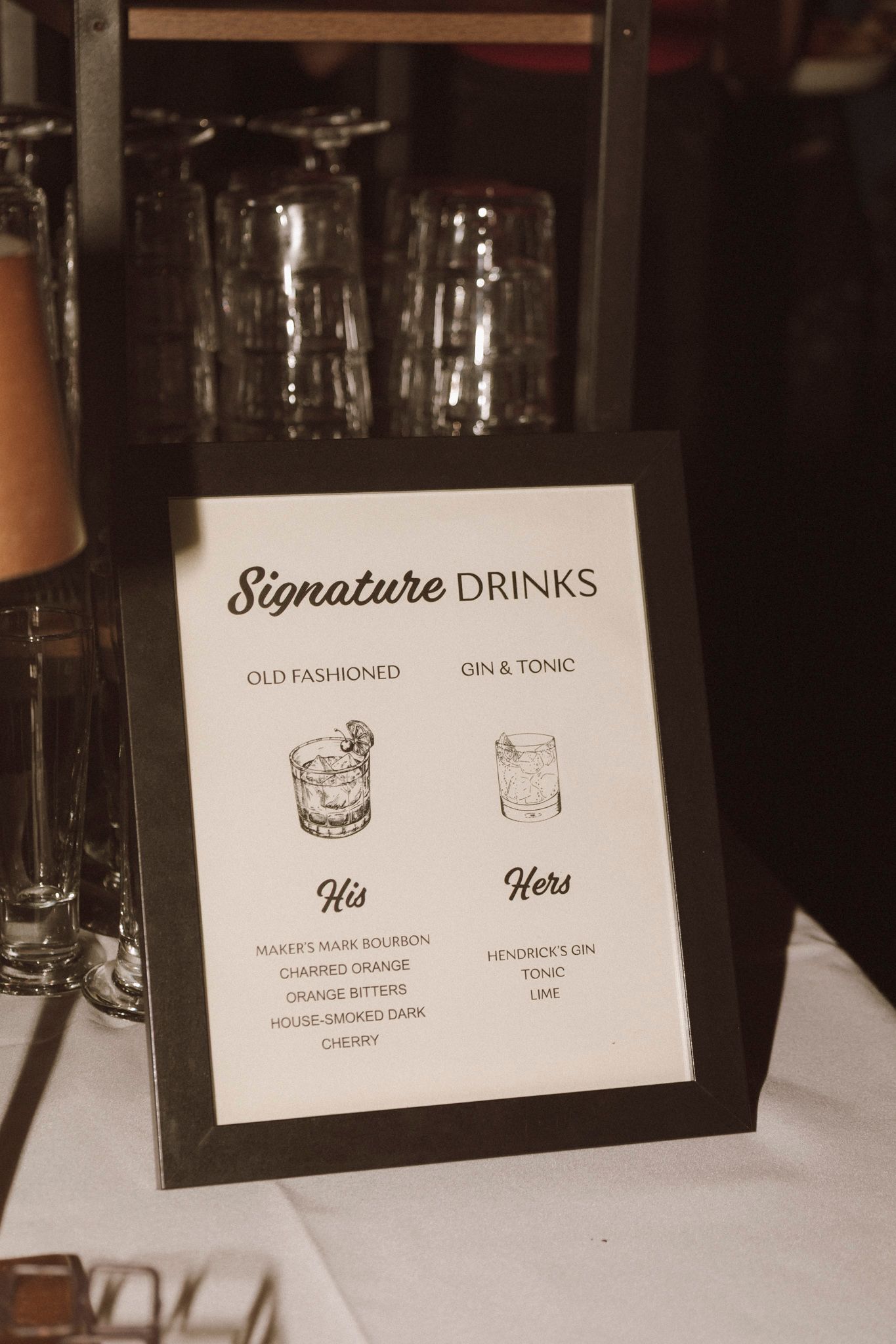 Elegant signature drinks sign at wedding reception featuring His Old Fashioned and Hers Gin and Tonic cocktail menus.