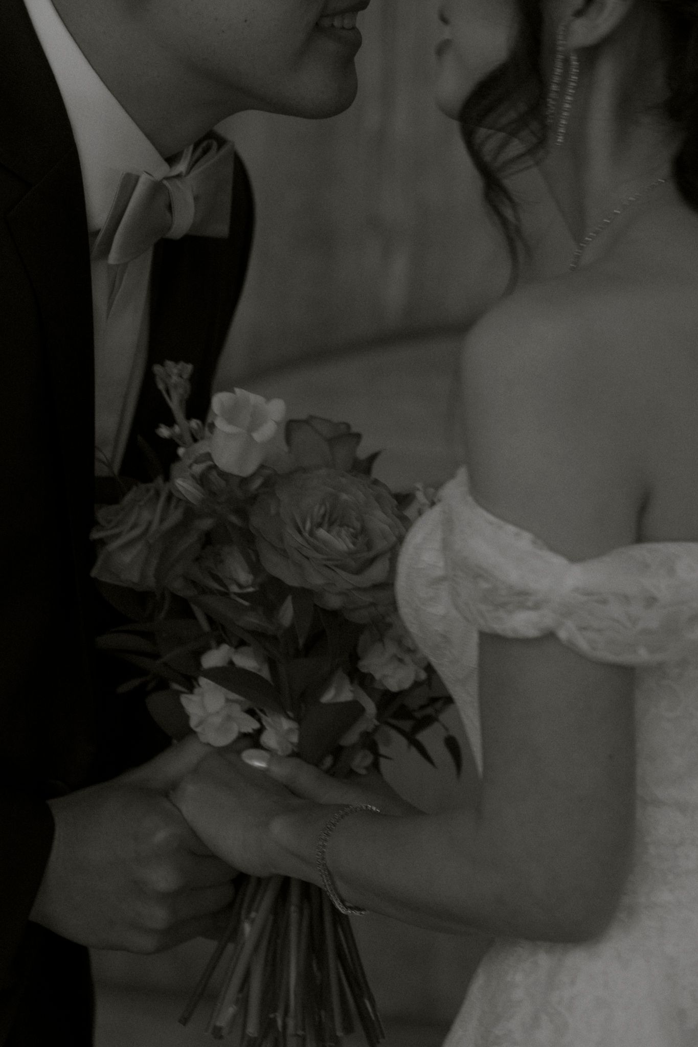 Black and white photo series showing close-up details of a bride holding a wedding bouquet.