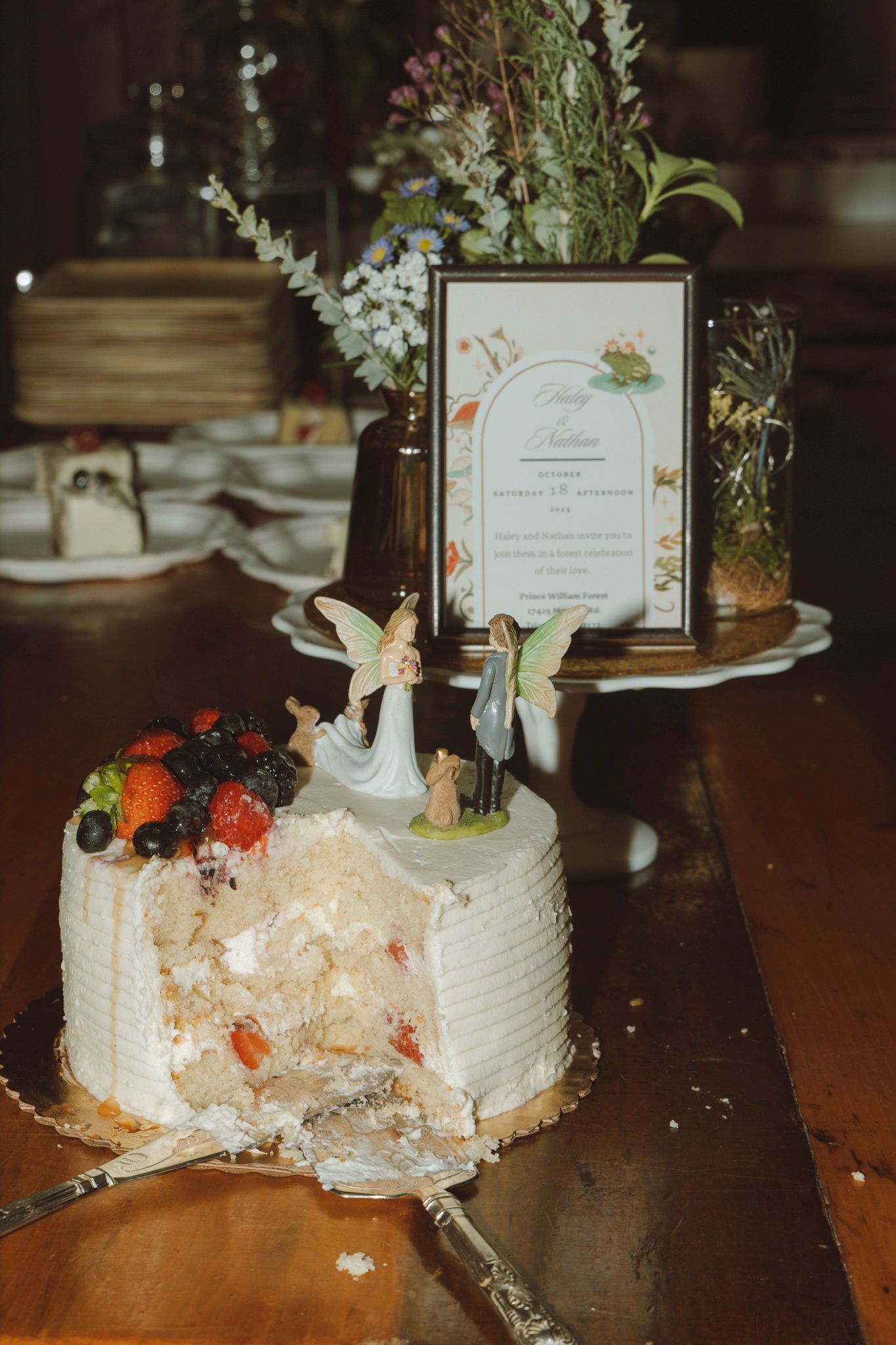 A sequence of photos showing a white wedding cake being progressively smashed and destroyed on a wooden table.