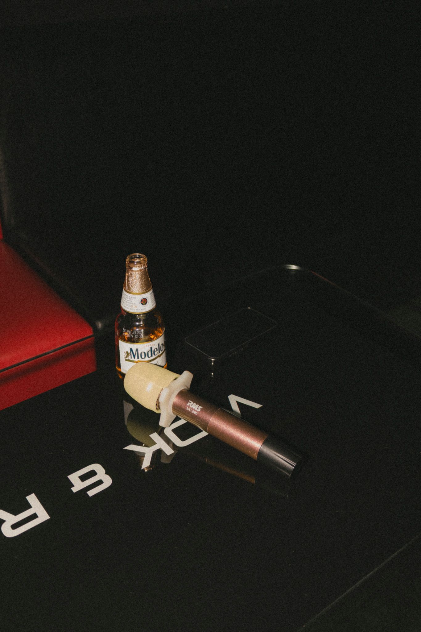 Close-up shots of a vintage microphone and audio equipment against a dark background.
