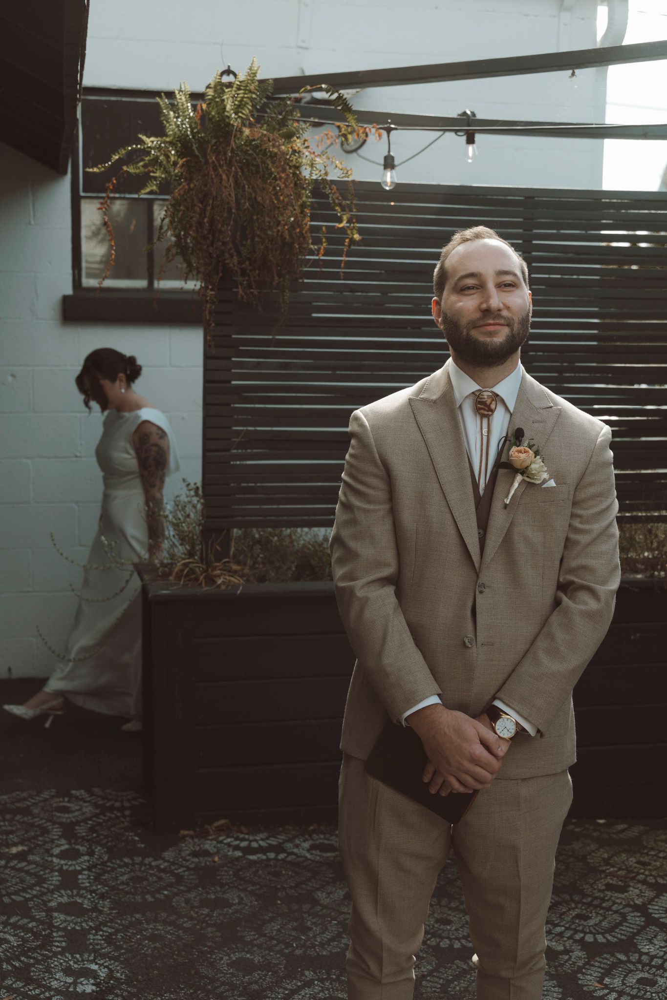 A series of candid moments showing a person in a tan suit posing playfully in an outdoor garden setting.