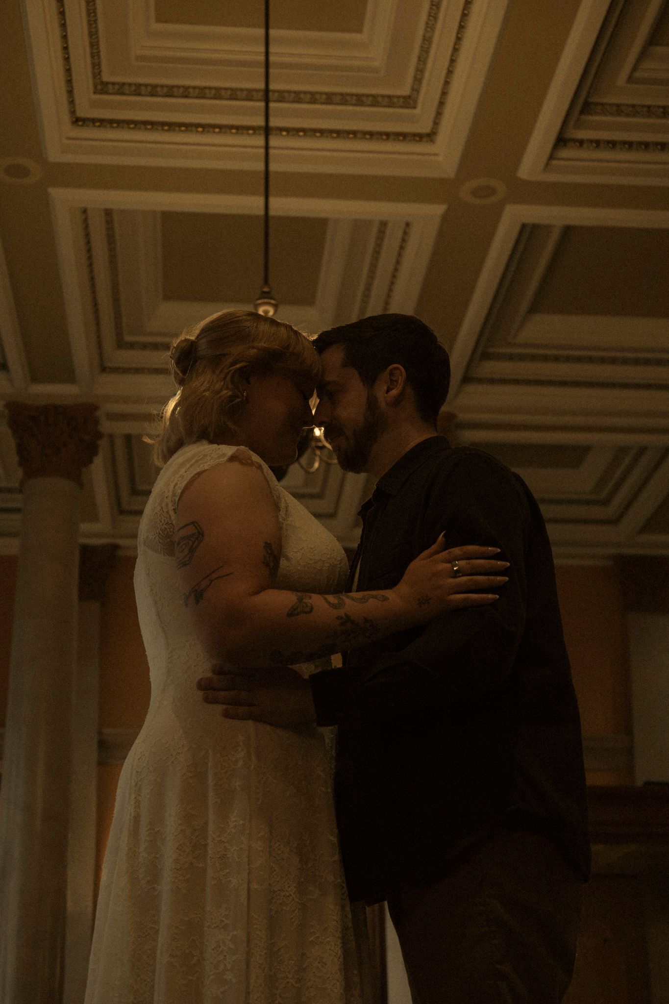 A romantic wedding kiss sequence showing four progressive moments of a couple sharing their first kiss as newlyweds.