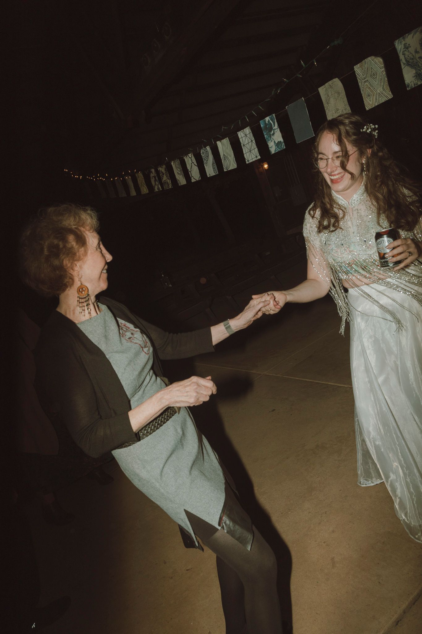 A sequence of dance photos showing two people spinning and twirling together in a dimly lit space.