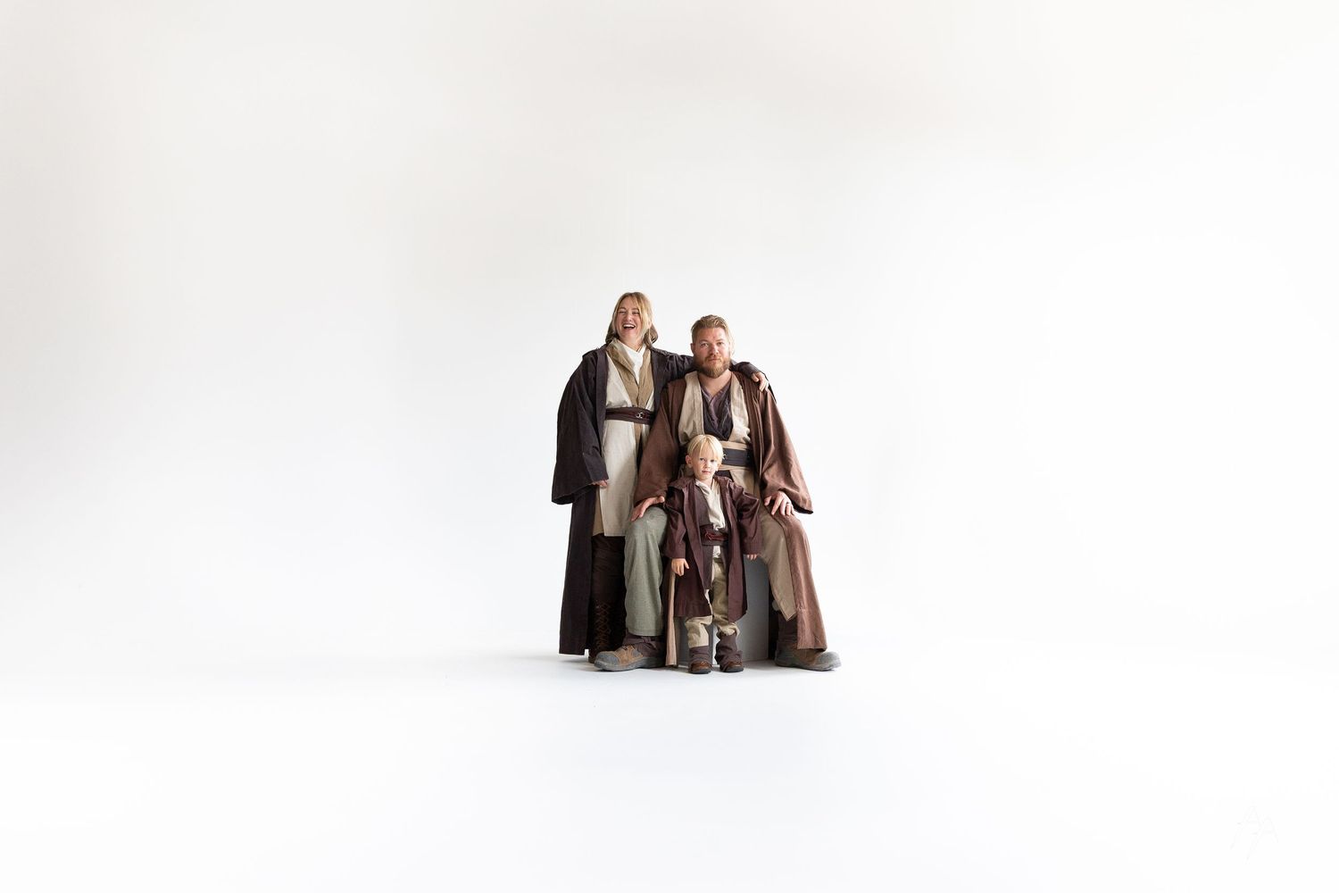 Series of photos showing people in brown robes falling down dramatically against a white background.