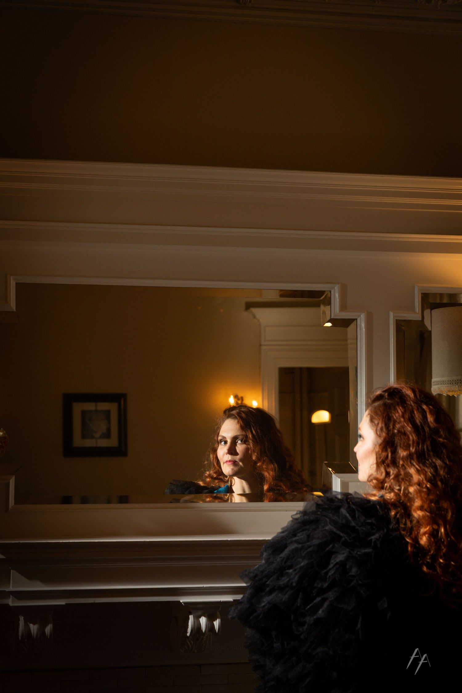 A dark, moody sequence of someone looking through a doorway or opening in dramatic lighting.