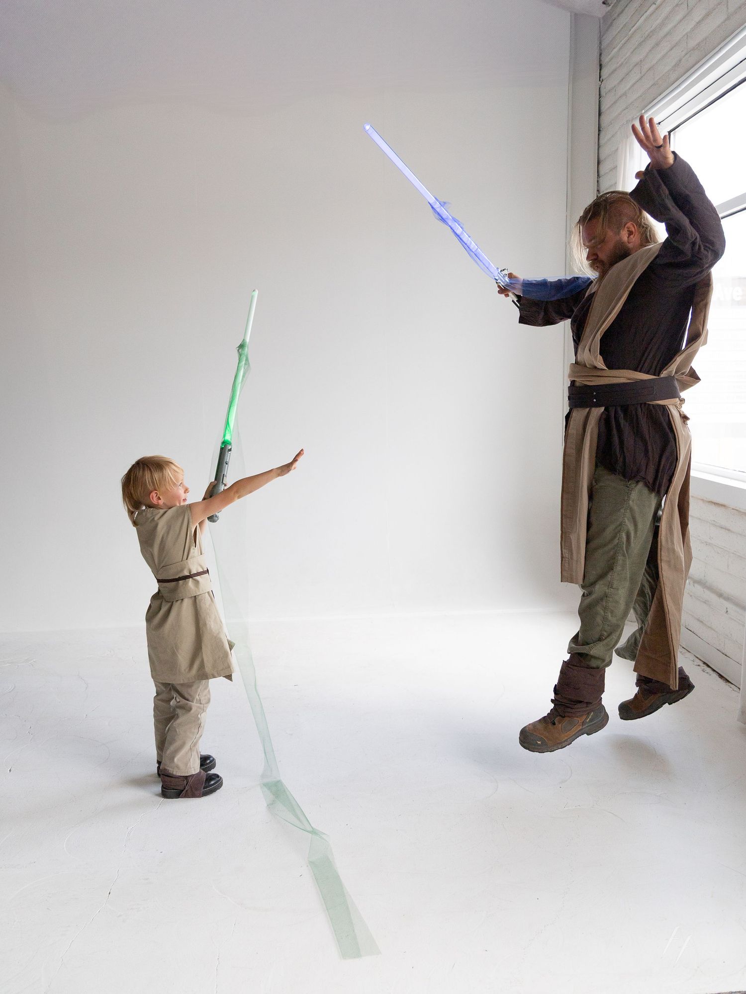Sequence showing lightsaber duel choreography between two figures in Star Wars inspired costumes.