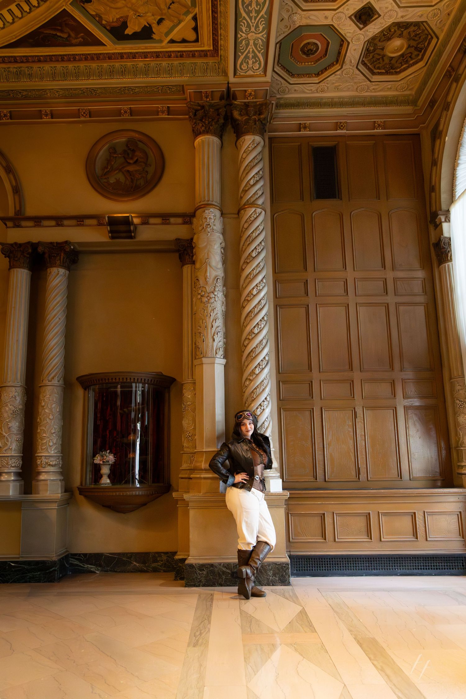 A sequence of interior shots showing an ornate historic ballroom with classical architectural details and polished wood floors.