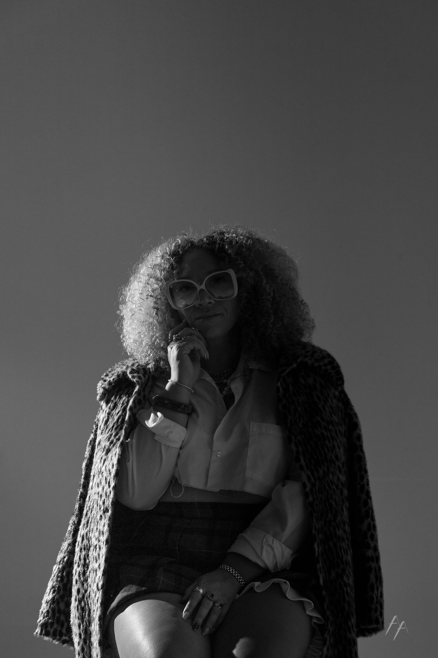 Artistic black and white portrait series showing dramatic lighting and poses.