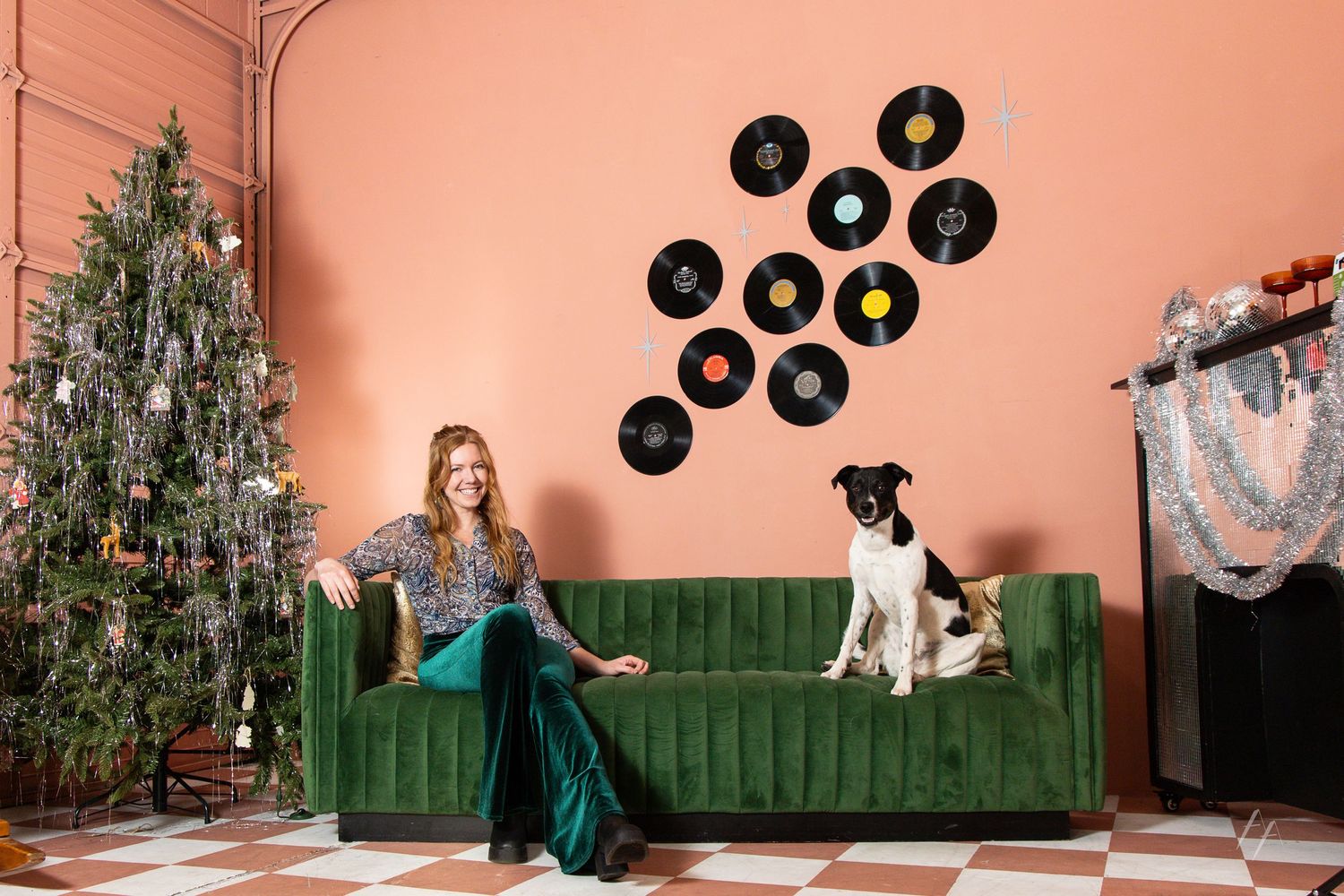 A creative photo collage showing vinyl records being tossed in the air against a pink wall with a green couch.