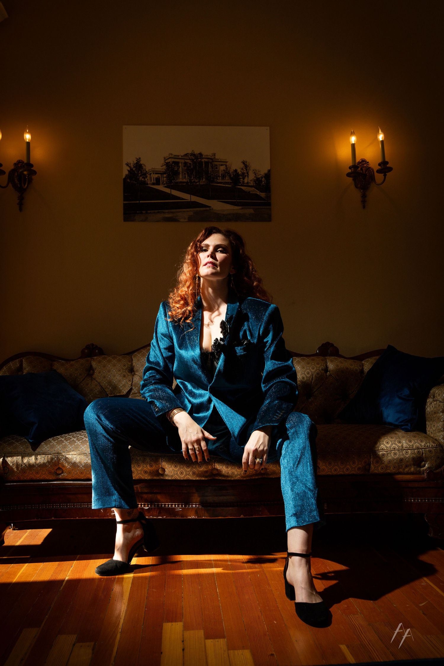A moody series of photos showing someone in blue denim sitting on wooden stairs in dramatic low lighting.