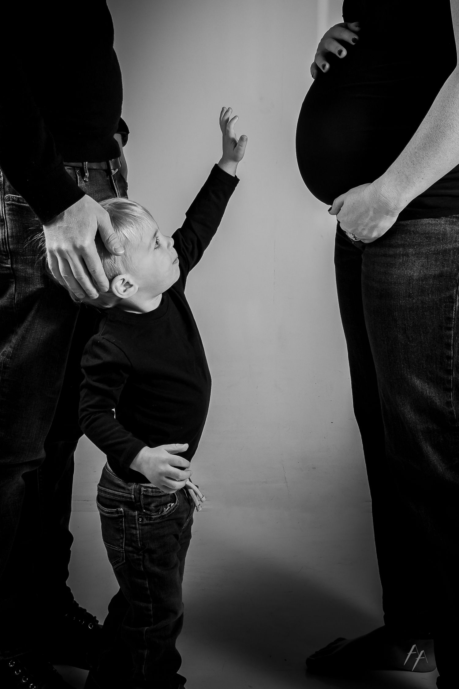 A series of black and white photos showing hands in pockets from different angles against a plain background.