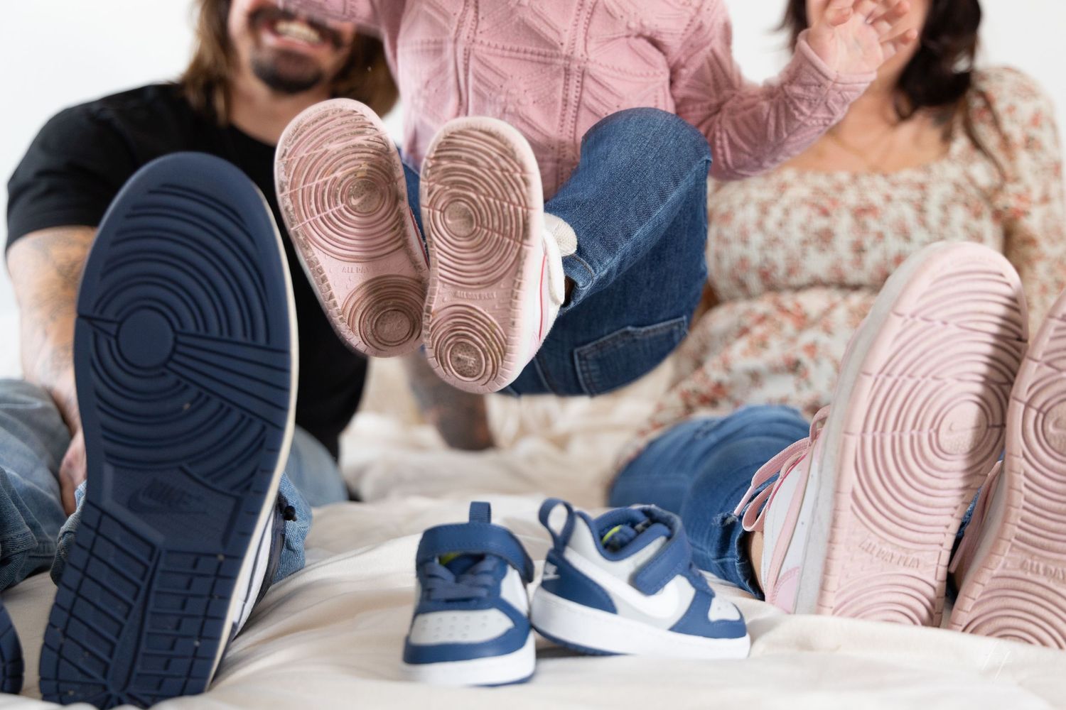 Close-up detail shots of blue and white Nike sneakers with pink and beige backgrounds.