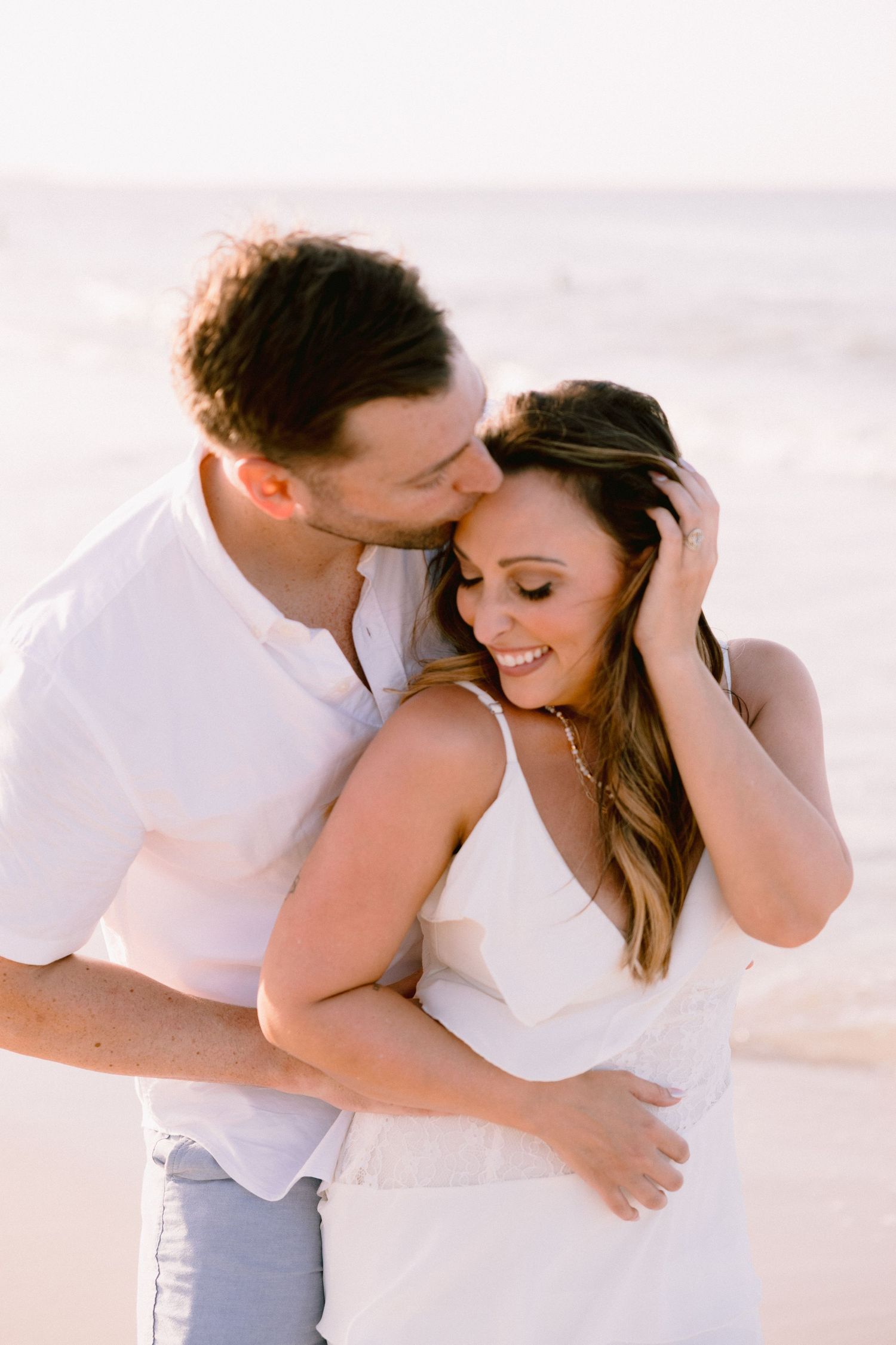 Couple laughing during their 10-year anniversary photography session in Punta Cana
