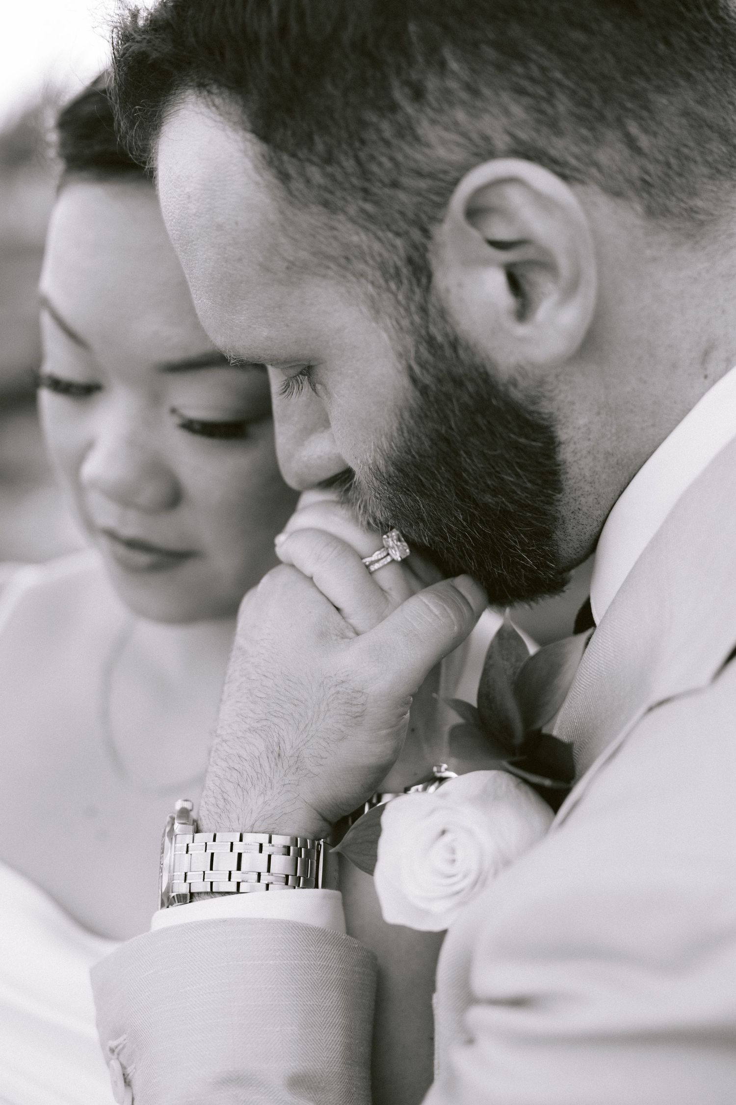 A romantic black and white photo series showing tender moments between a couple in close embrace.