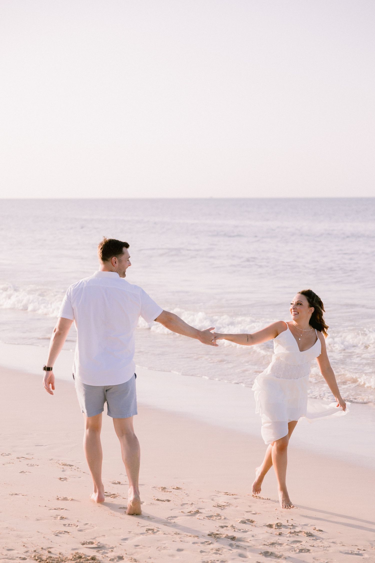 Barefoot couple celebrating their anniversary on a Punta Cana beach