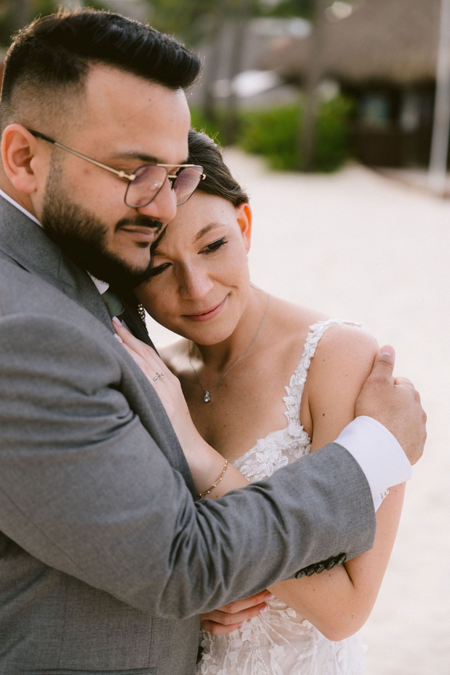 A tender moment between newlyweds sharing an intimate embrace during their wedding photoshoot.