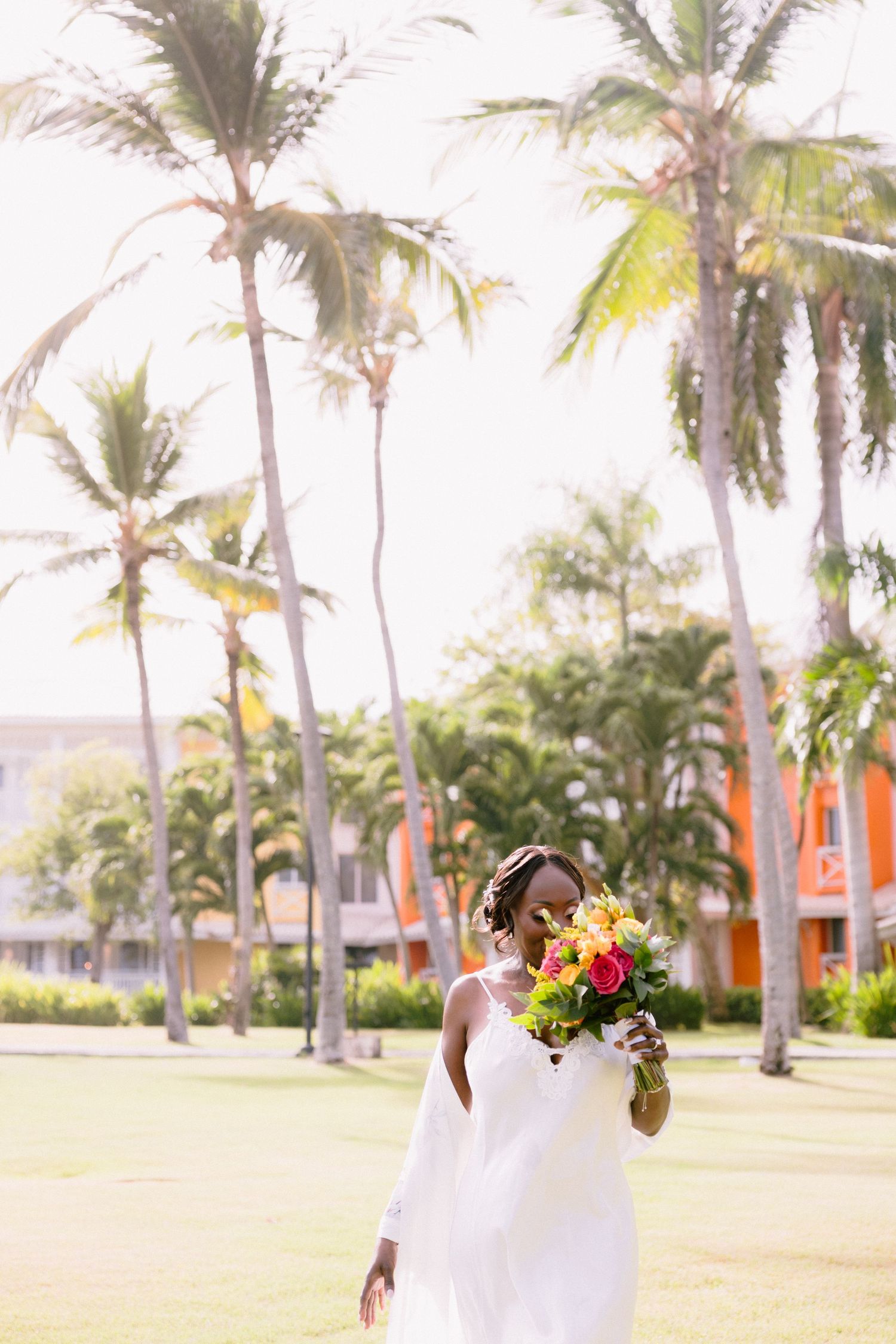 A tropical beach wedding scene with palm trees and a flowing white dress captured in a multi-image collage.
