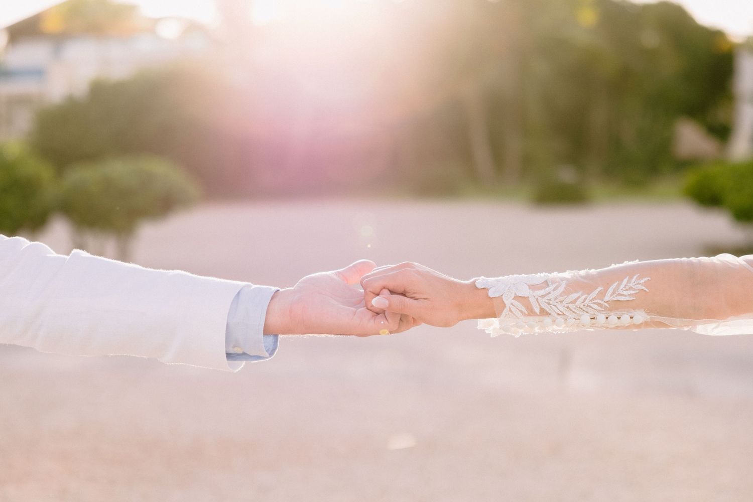 A series of romantic wedding photos showing hands, rings, and soft light effects creating an intimate atmosphere.