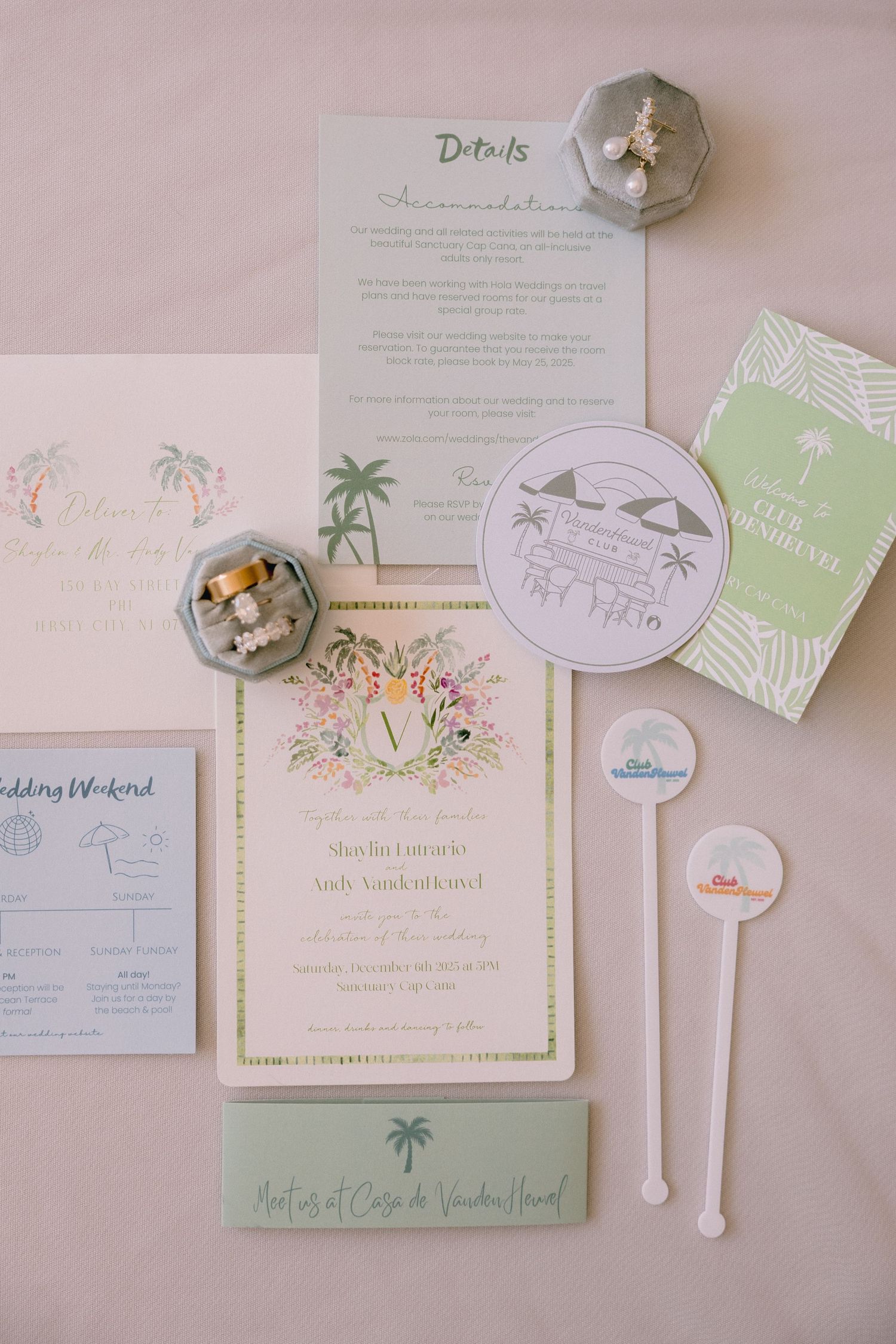 Elegant tropical wedding invitation suite with palm tree motifs, gold accents, and pastel green details on a soft pink background.