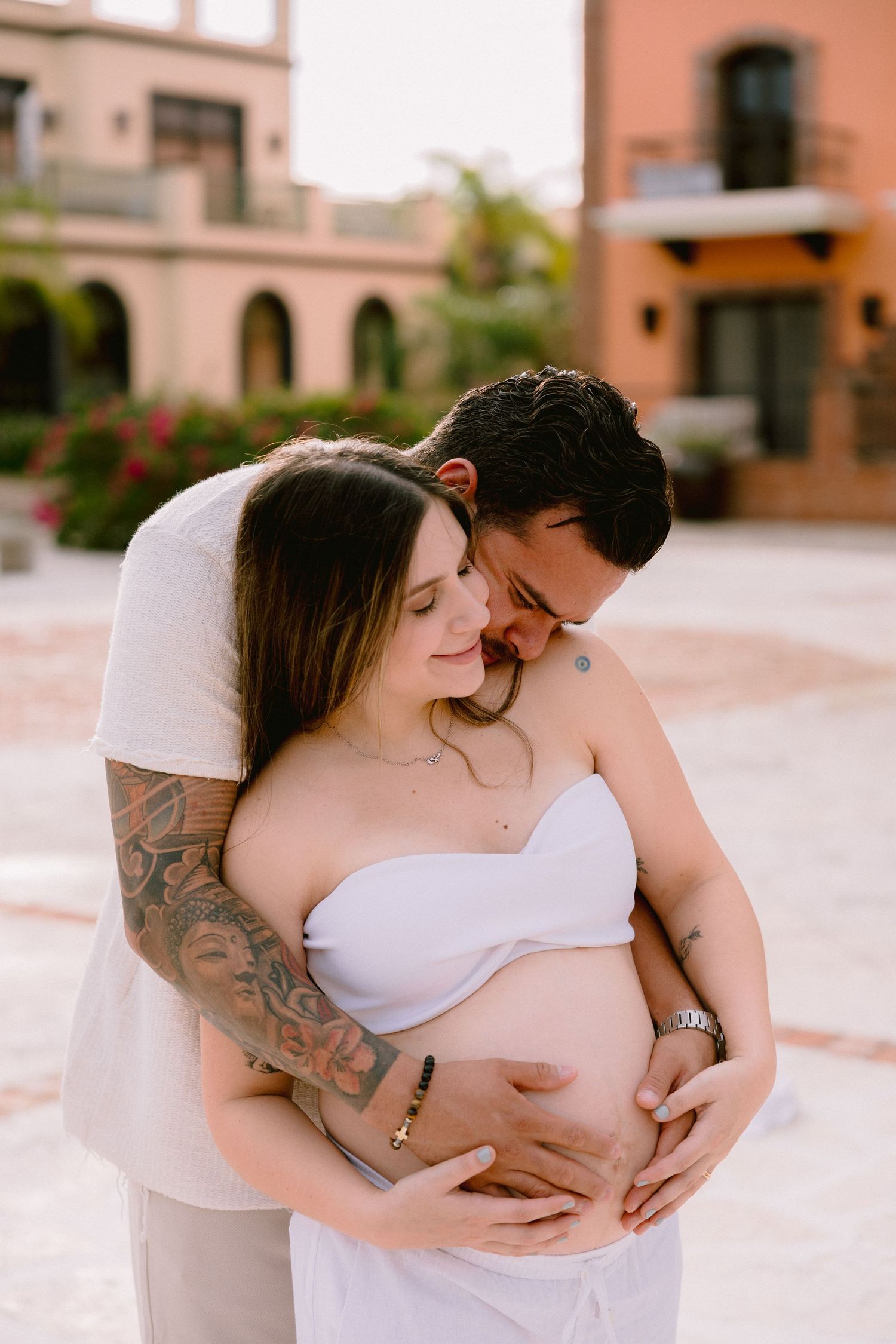 A romantic maternity photoshoot sequence showing tender intimate moments between an expecting couple outdoors.