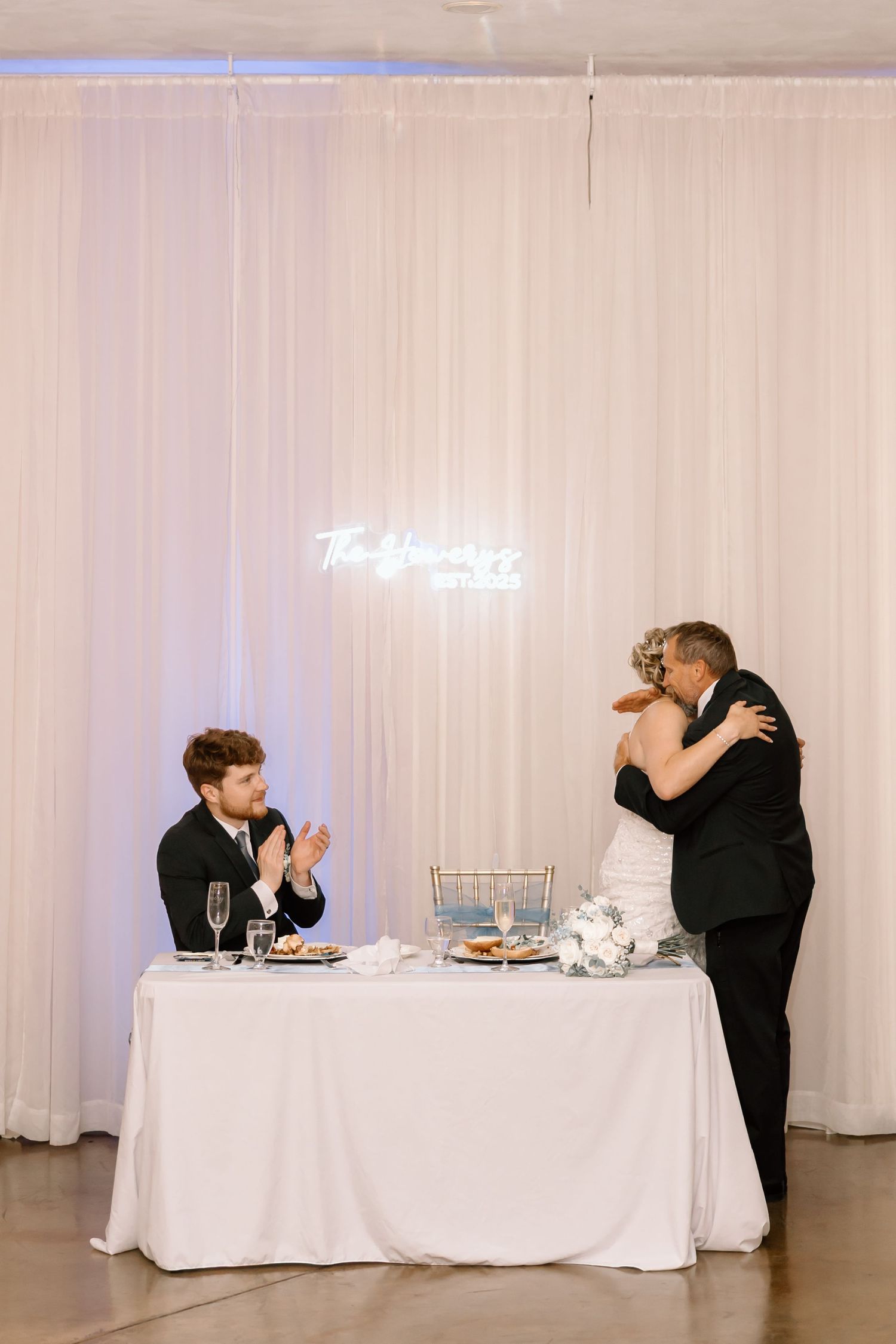 A sequence of wedding reception photos showing a couple at a head table enjoying their first meal together.
