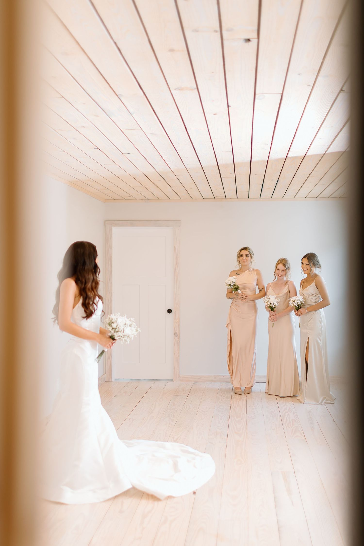 A sequence of elegant bridal party photos in a bright white room with bridesmaids in champagne dresses.