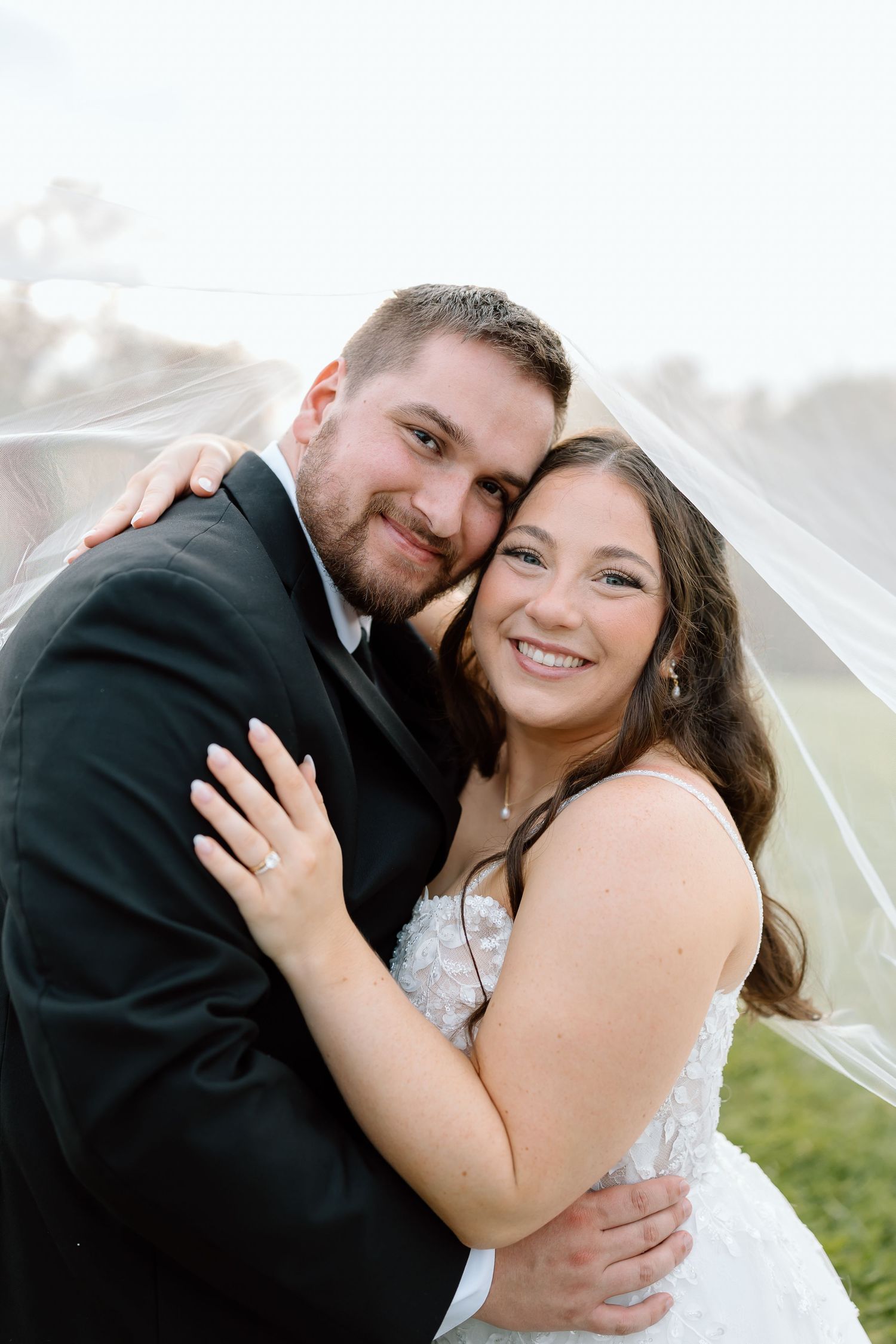 A romantic wedding couple embraces under cloudy skies in a series of close-up photos.