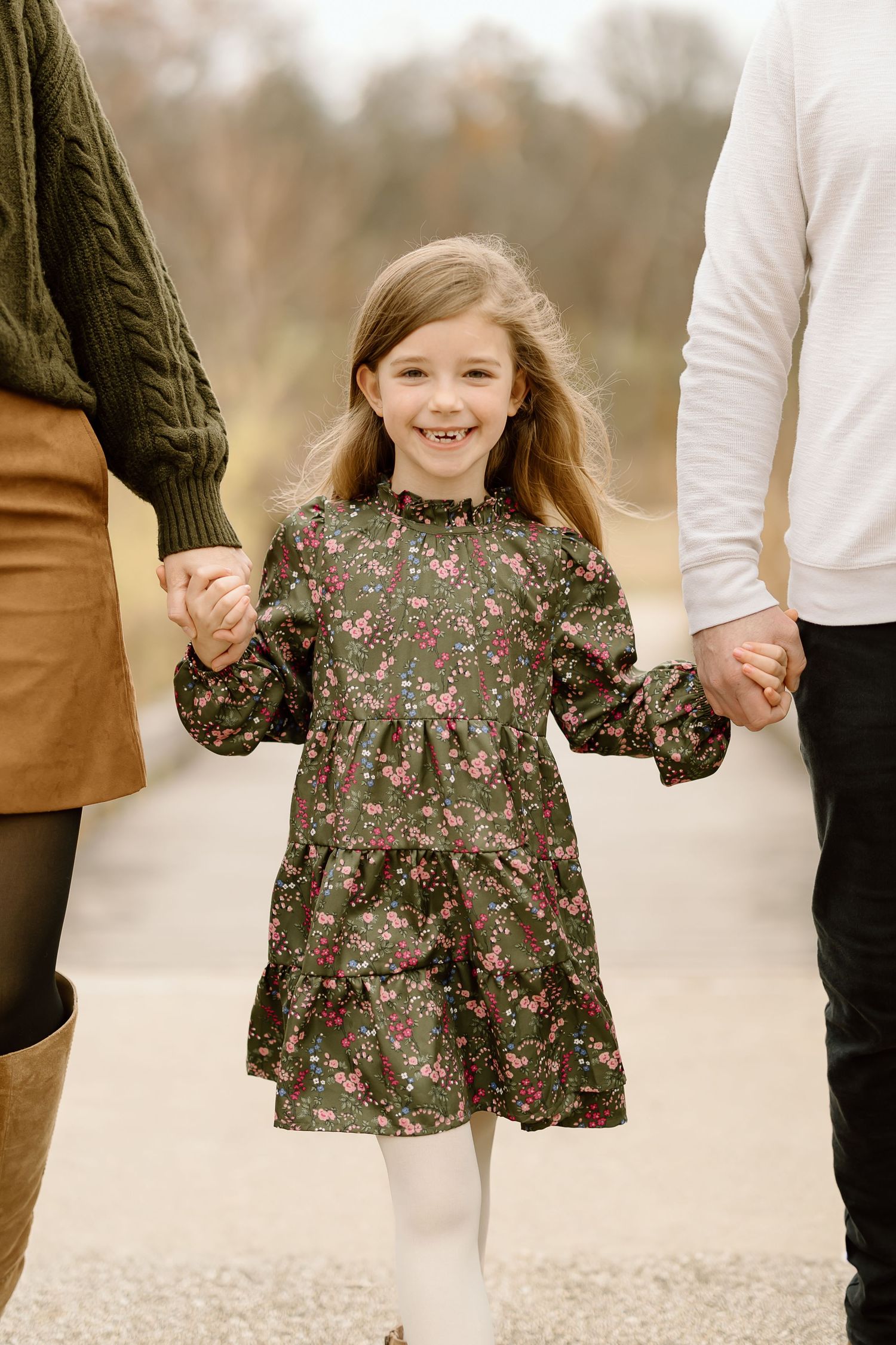 Close up of floral dress detail during autumn family photoshoot.