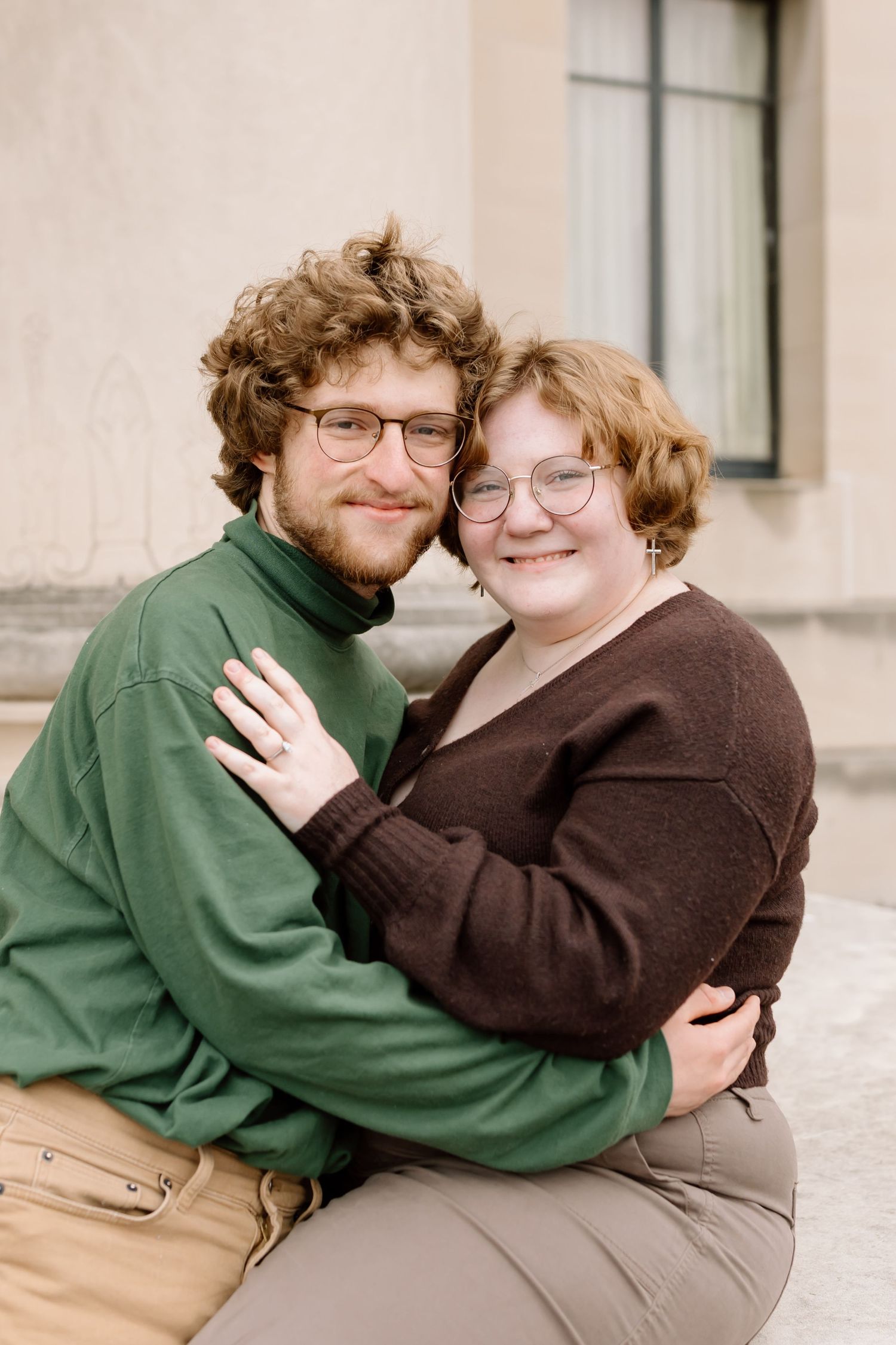 A couple in green and brown clothing share tender embraces in a series of romantic outdoor photos.