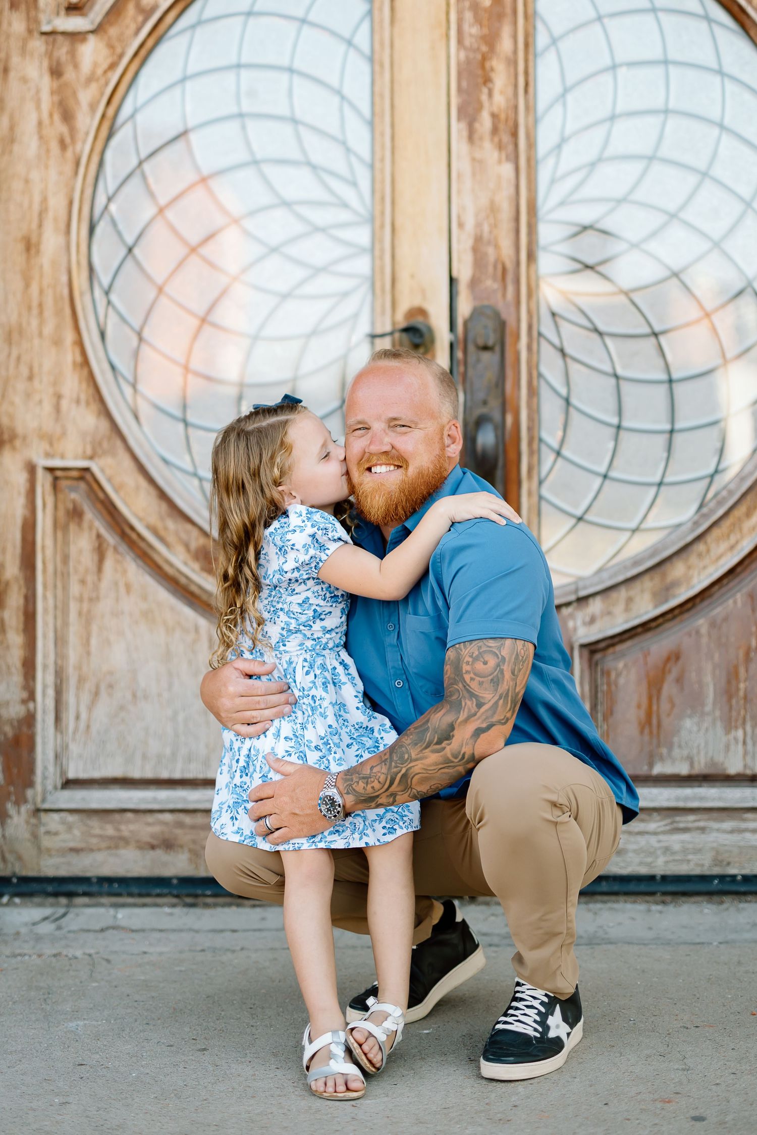 A sweet candid moment captured in a series of four photos showing affection against circular window backdrop.