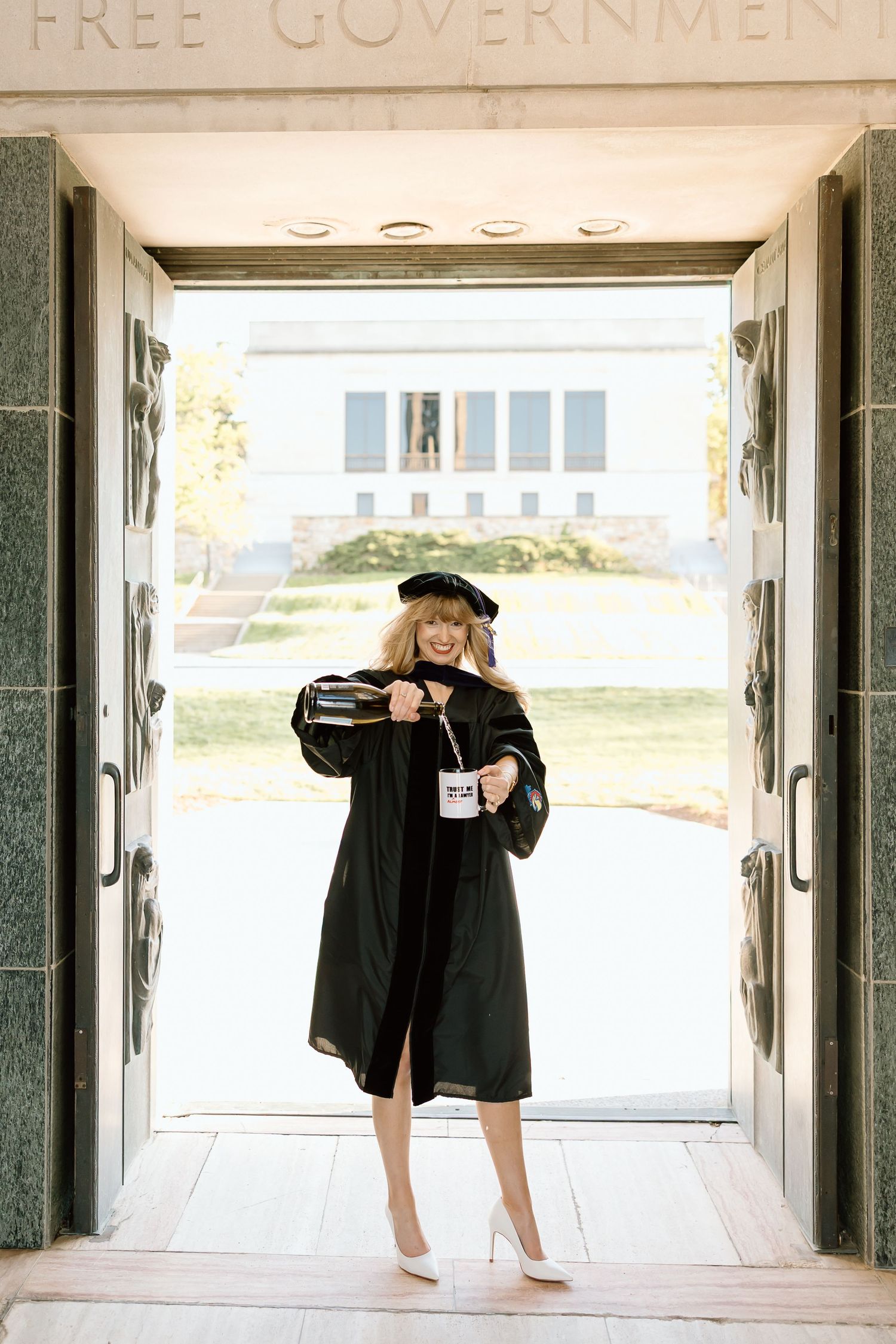 Three black and white photos show a figure in a black graduation gown bending over in different poses in a hallway.