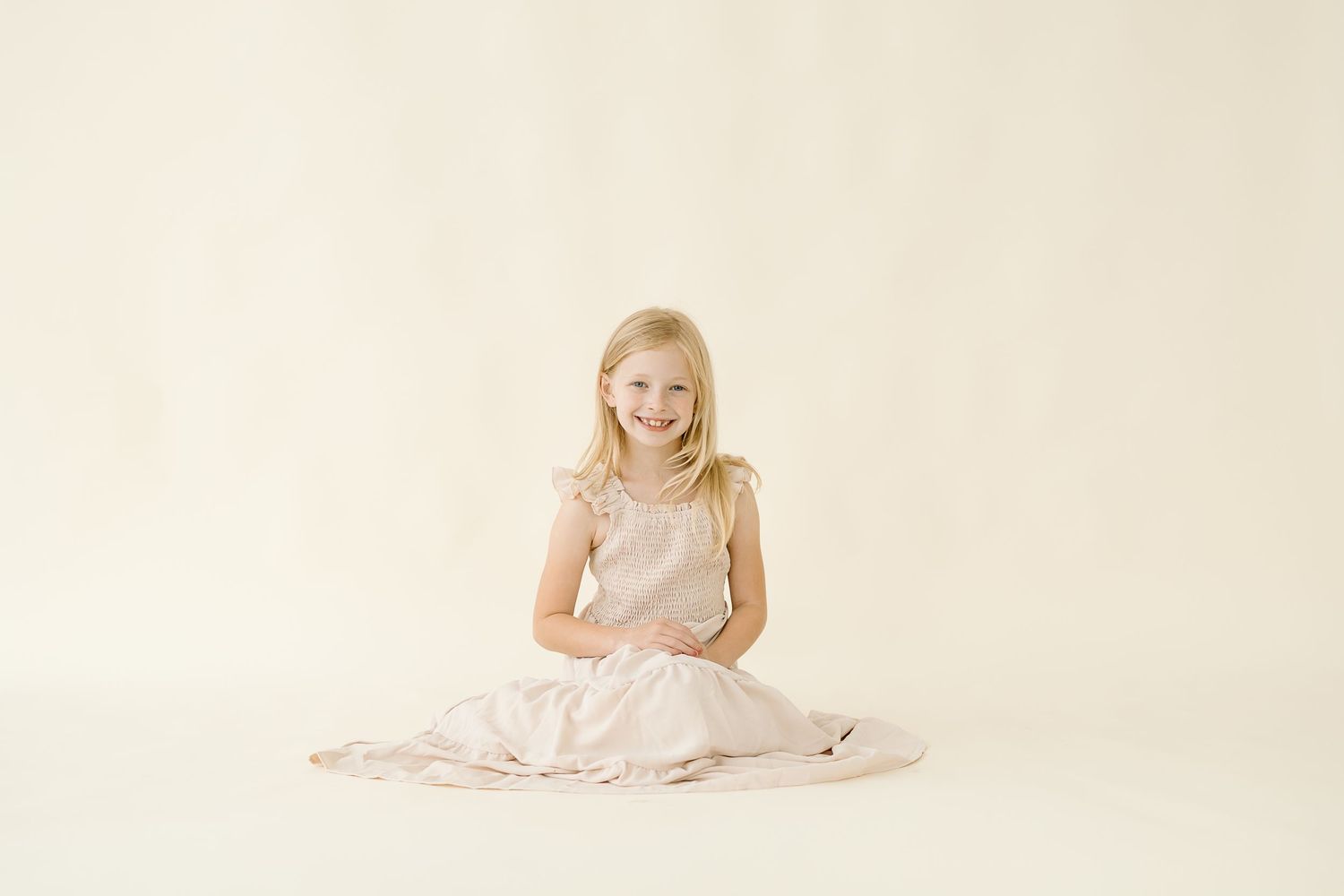 A series of four similar light-toned images arranged horizontally showing a person in soft, dreamy lighting.
