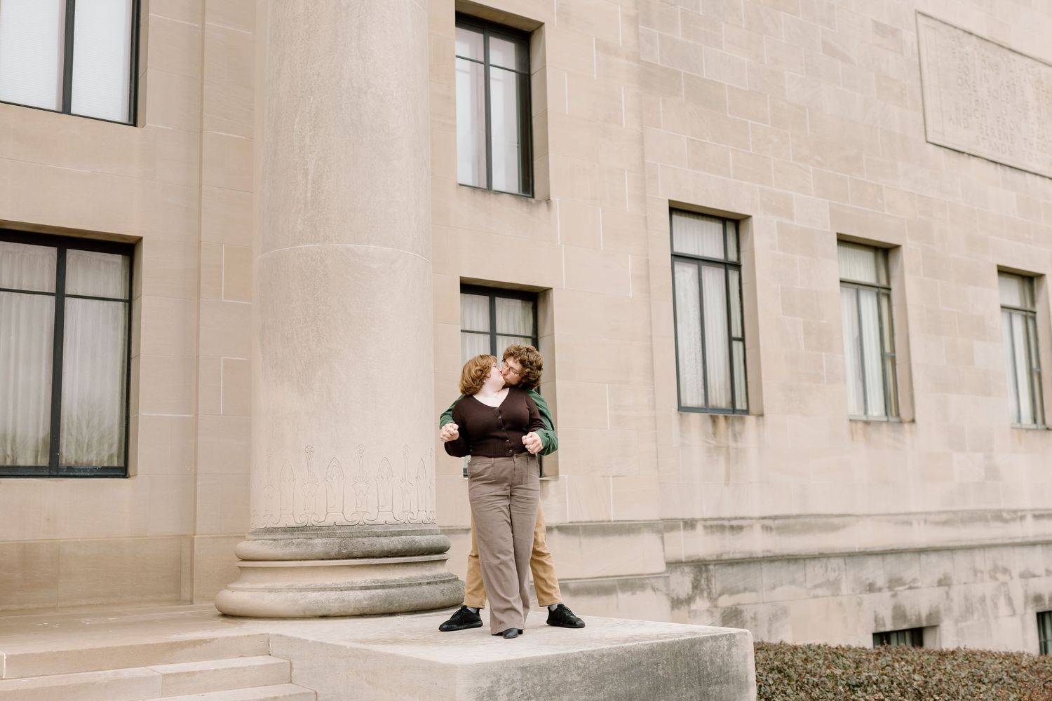 A series of connected photos showing someone sitting and reading on steps outside a building.