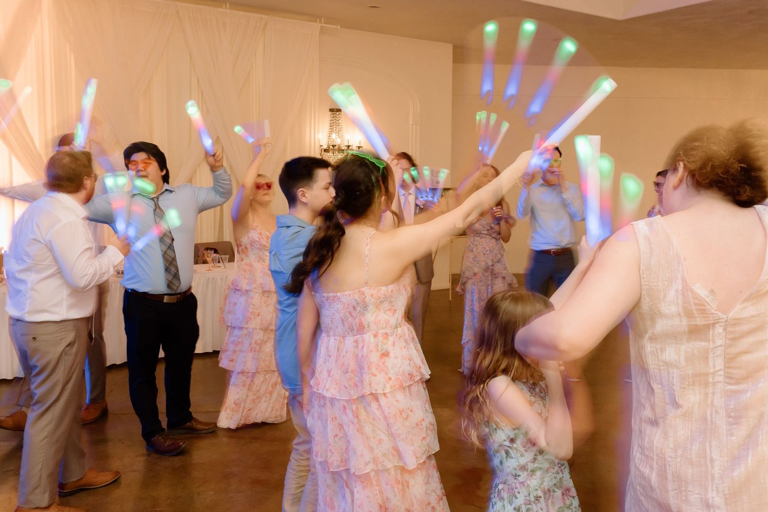 A sequence of wedding reception dance photos showing guests enjoying themselves on the dance floor.