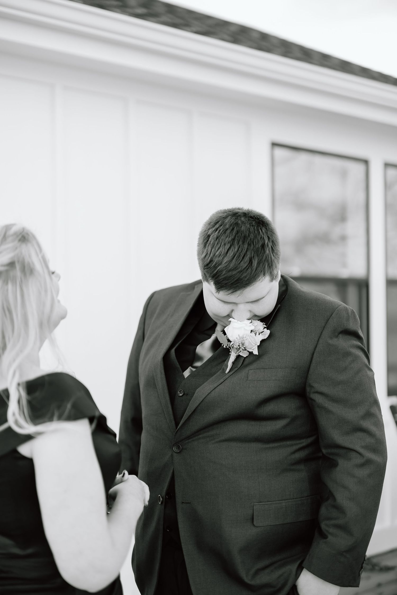 Black and white photo series showing emotional moments between a couple at a wedding ceremony.