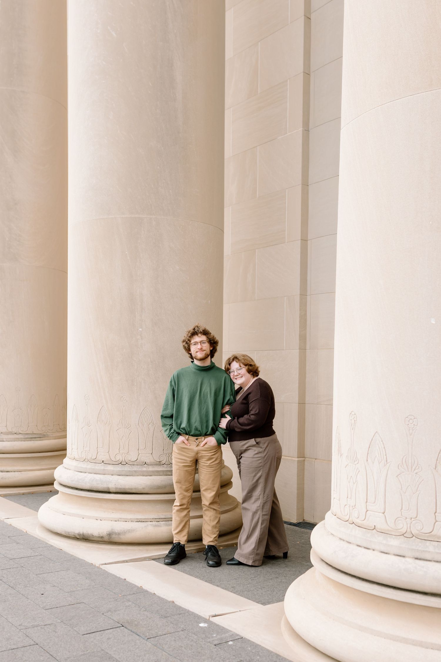 Series of elegant white columns at a neoclassical building creating a repeating architectural pattern.