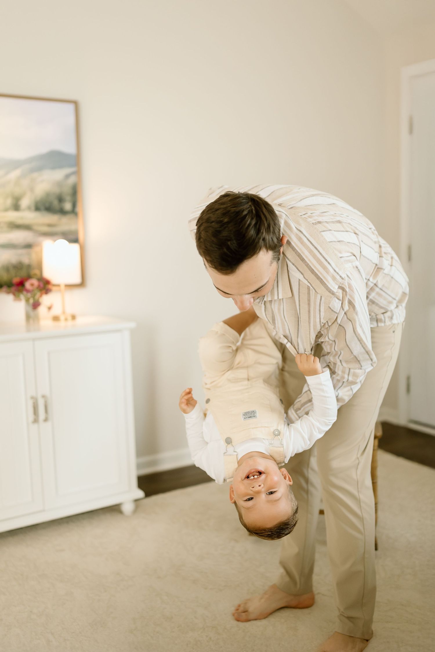 A sequence of images showing someone in beige clothing bending over backwards in a bright white room.