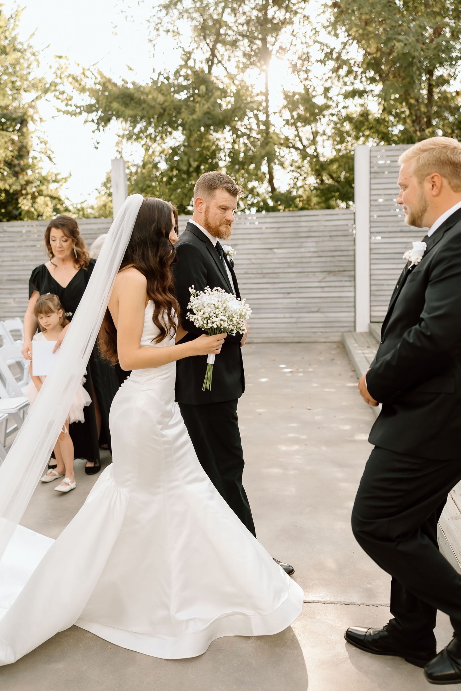 A series of candid wedding photos showing dancing and twirling movements between a couple in formal attire.