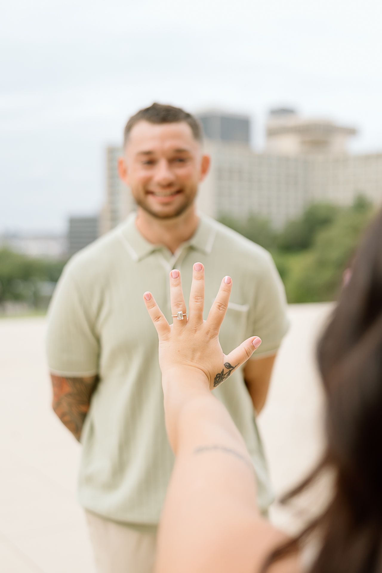 A series of photos showing someone proposing with an engagement ring in an outdoor urban setting.