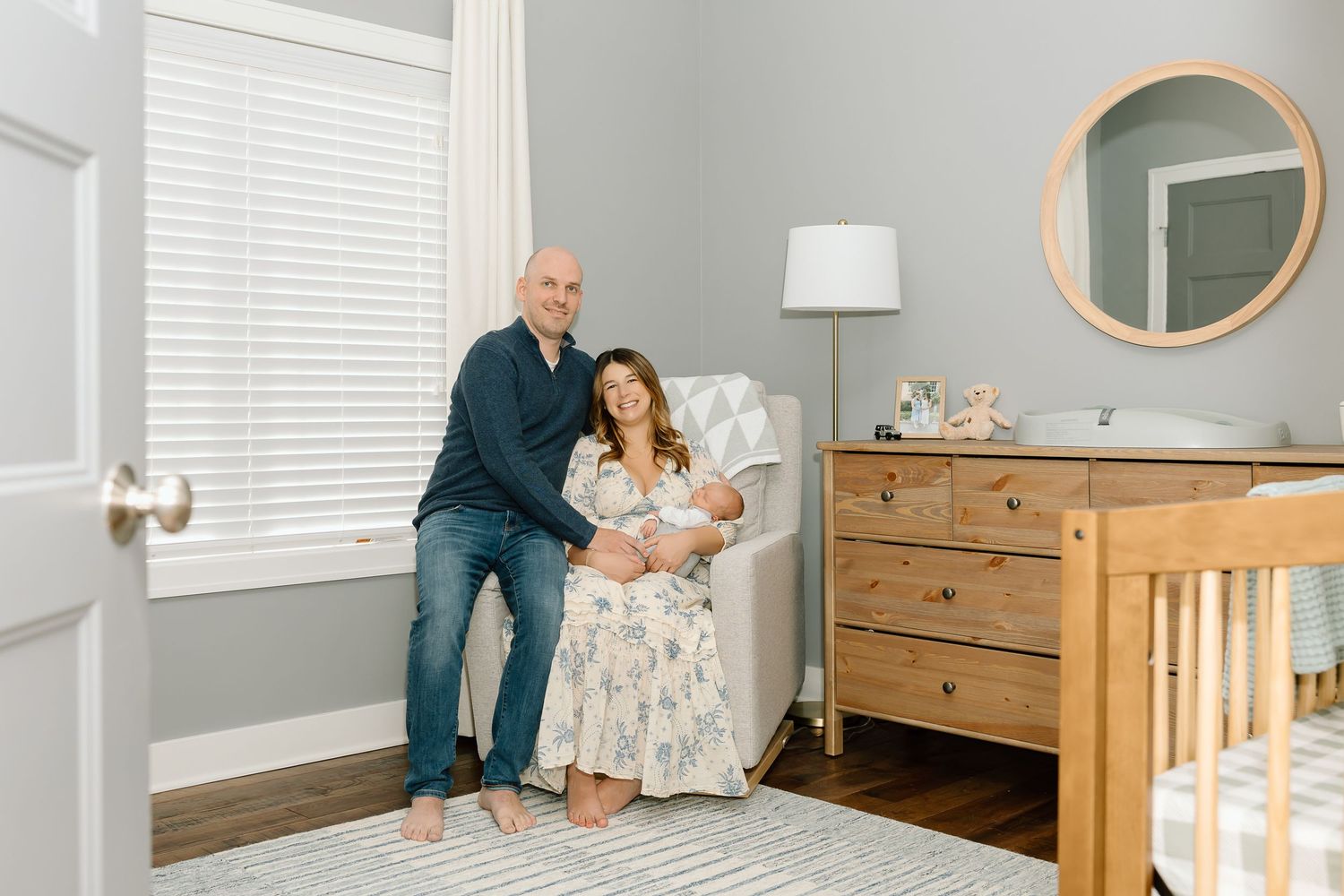 A series of photos showing a nursery room reveal with modern wooden furniture and white walls.