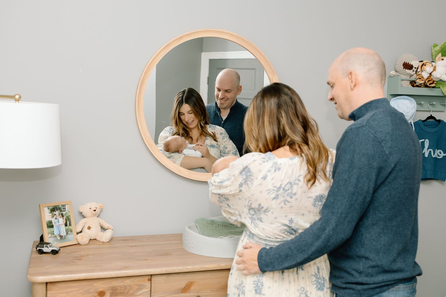 A collage of family photos showing tender moments in a nursery with soft gray walls and natural lighting.