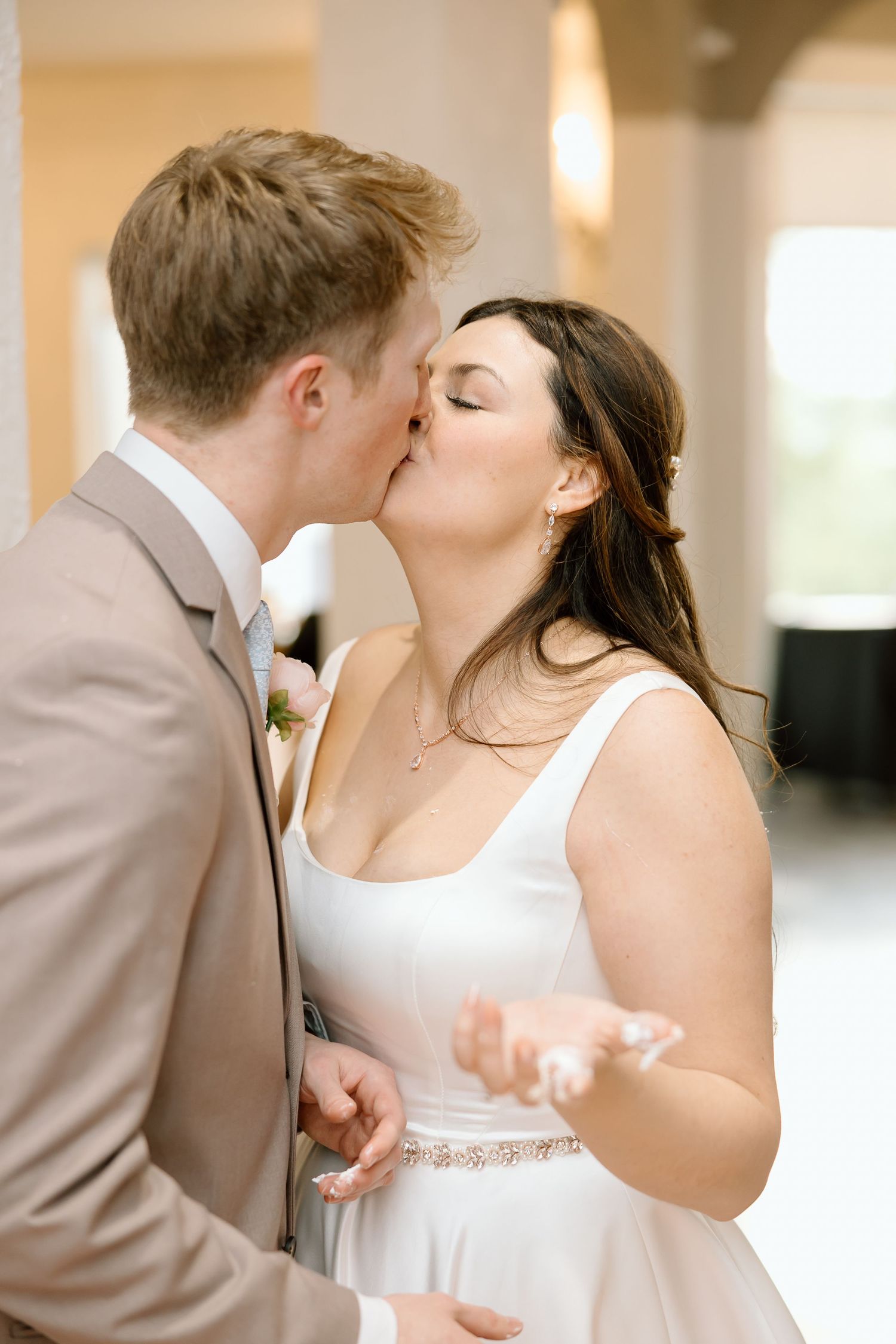 A romantic sequence of wedding photos showing a couple sharing tender kisses while dressed in formal attire.